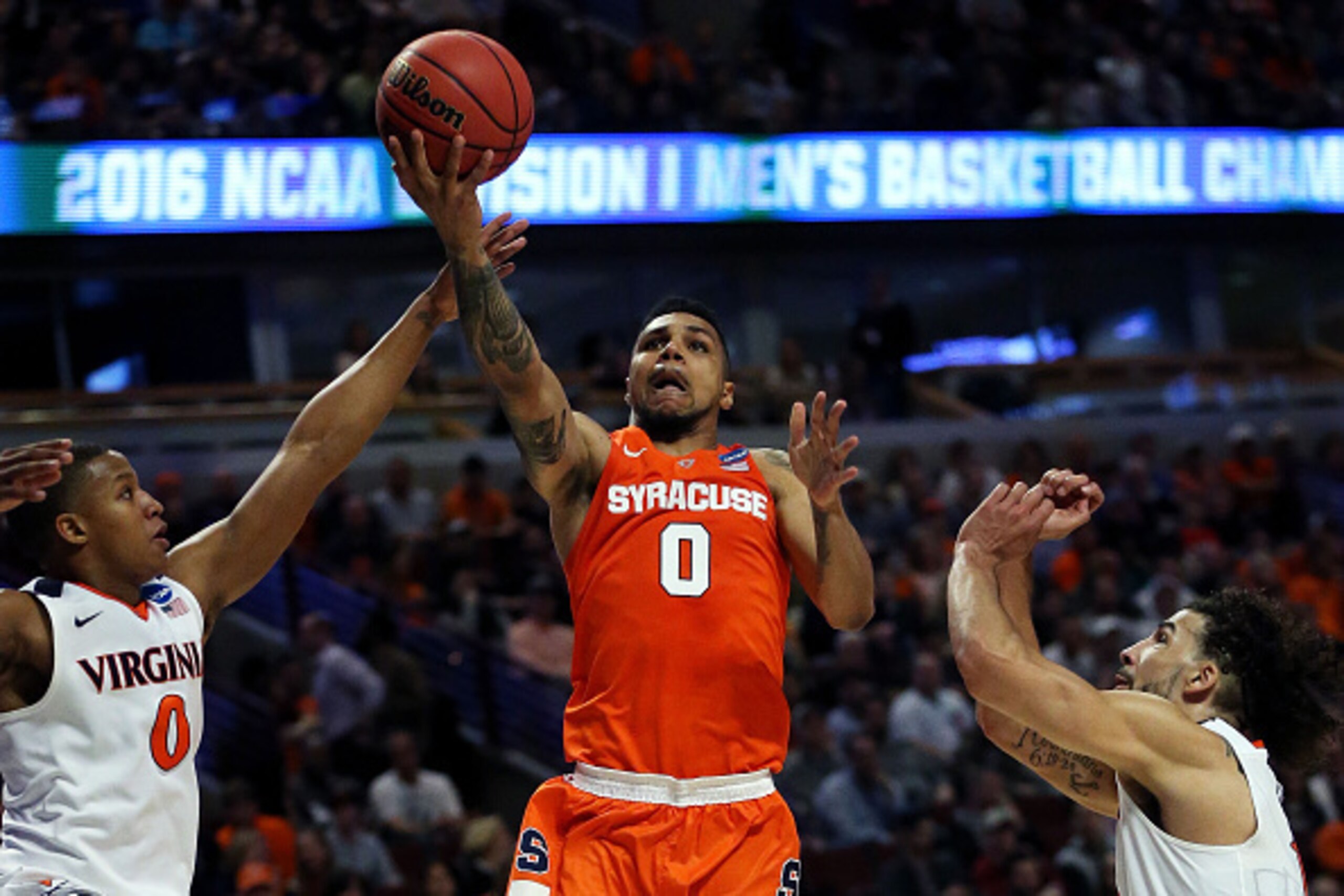 CHICAGO, IL - MARCH 27:  Michael Gbinije #0 of the Syracuse Orange shoots against Devon Hall #0 of the Virginia Cavaliers in the first half during the 2016 NCAA Men's Basketball Tournament Midwest Regional Final at United Center on March 27, 2016 in Chica