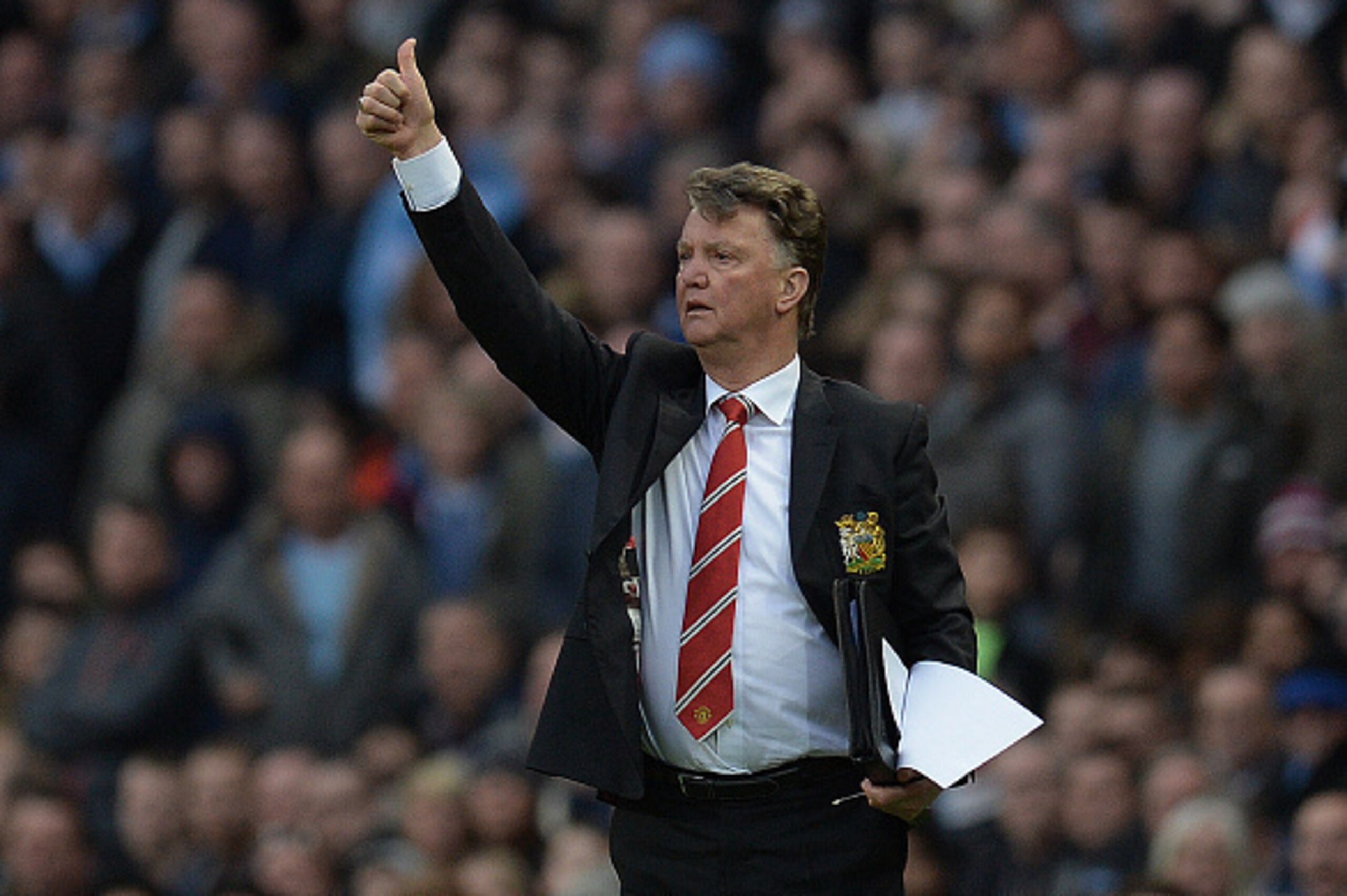 Manchester United's Dutch manager Louis van Gaal gestures as he shouts instructions to his players from the touchline during the English Premier League football match between Manchester City and Manchester United at the Etihad Stadium in Manchester, north