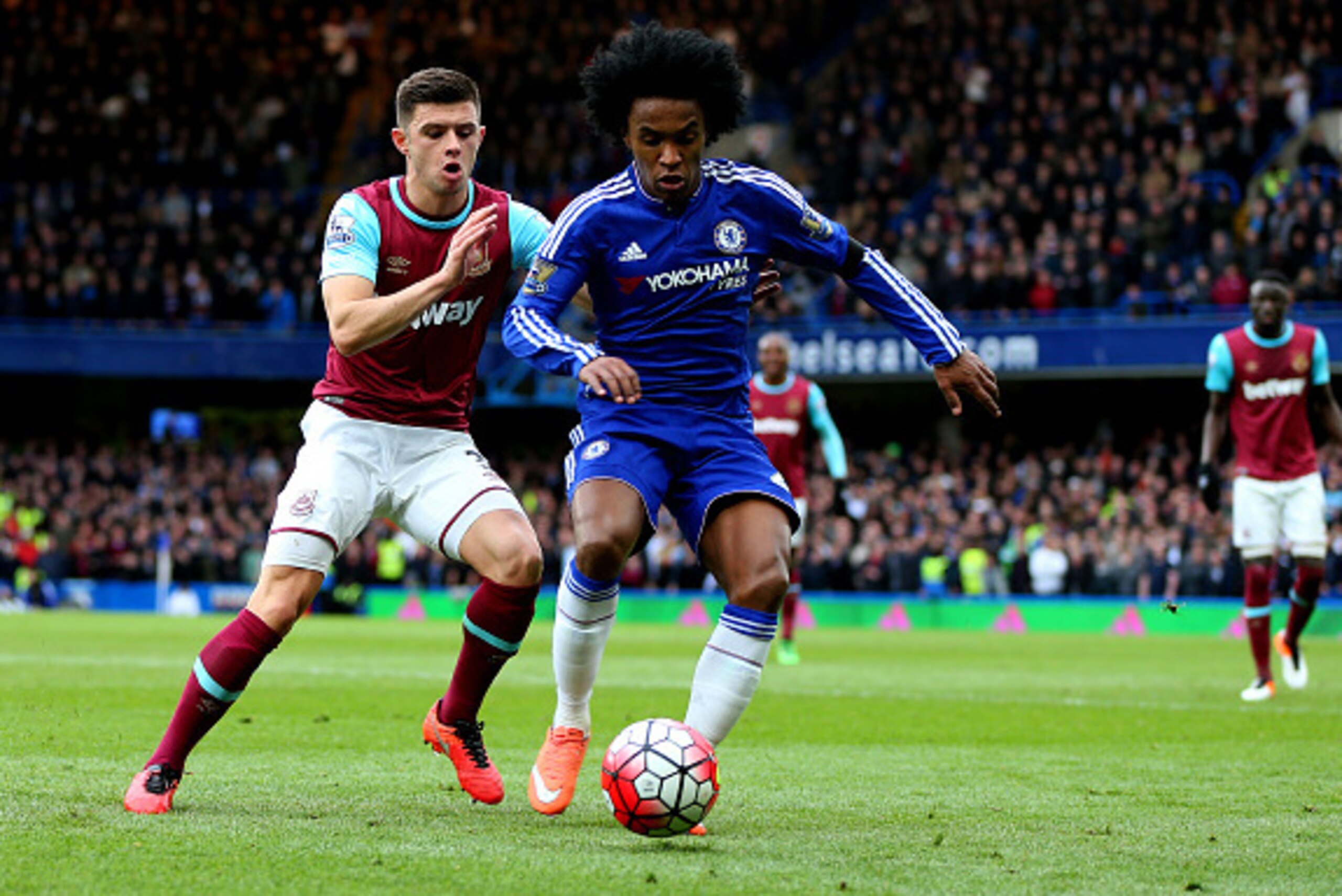 LONDON, ENGLAND - MARCH 19 :  Aaron Cresswell of West Ham United and Willian of Chelsea during the Barclays Premier League match between Chelsea and West Ham United at Stamford Bridge on March 19, 2016 in London, England.  (Photo by Catherine Ivill - AMA/