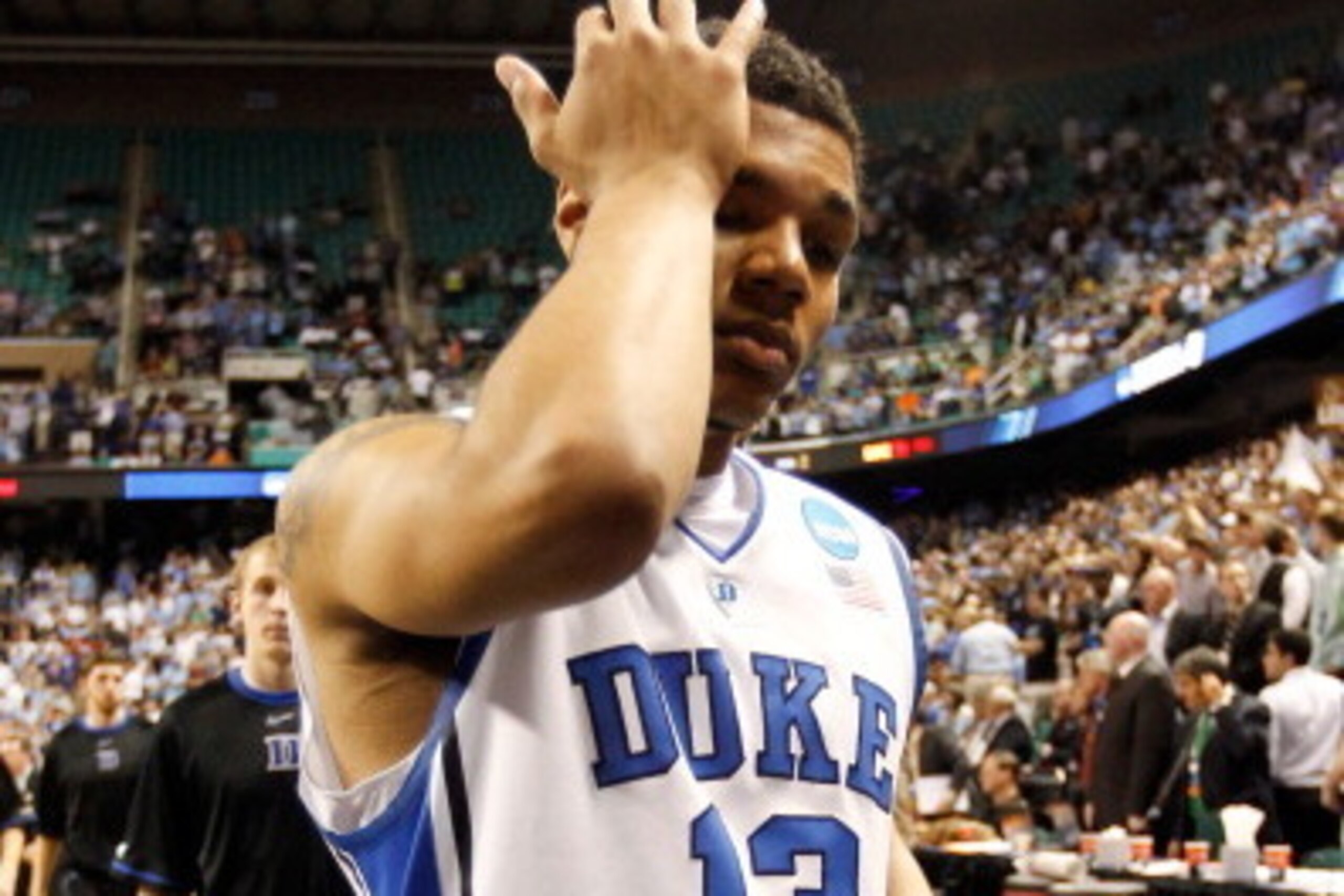 GREENSBORO, NC - MARCH 16: Michael Gbinije #13 of the Duke Blue Devils walks off the court after losing to the Lehigh Mountain Hawks 75-70 during the second round of the 2012 NCAA Men's Basketball Tournament at Greensboro Coliseum on March 16, 2012 in Gr GREENSBORO, NC - MARCH 16: Michael Gbinije #13 of the Duke Blue Devils walks off the court after losing to the Lehigh Mountain Hawks 75-70 during the second round of the 2012 NCAA Men's Basketball Tournament at Greensboro Coliseum on March 16, 2012 in Gr