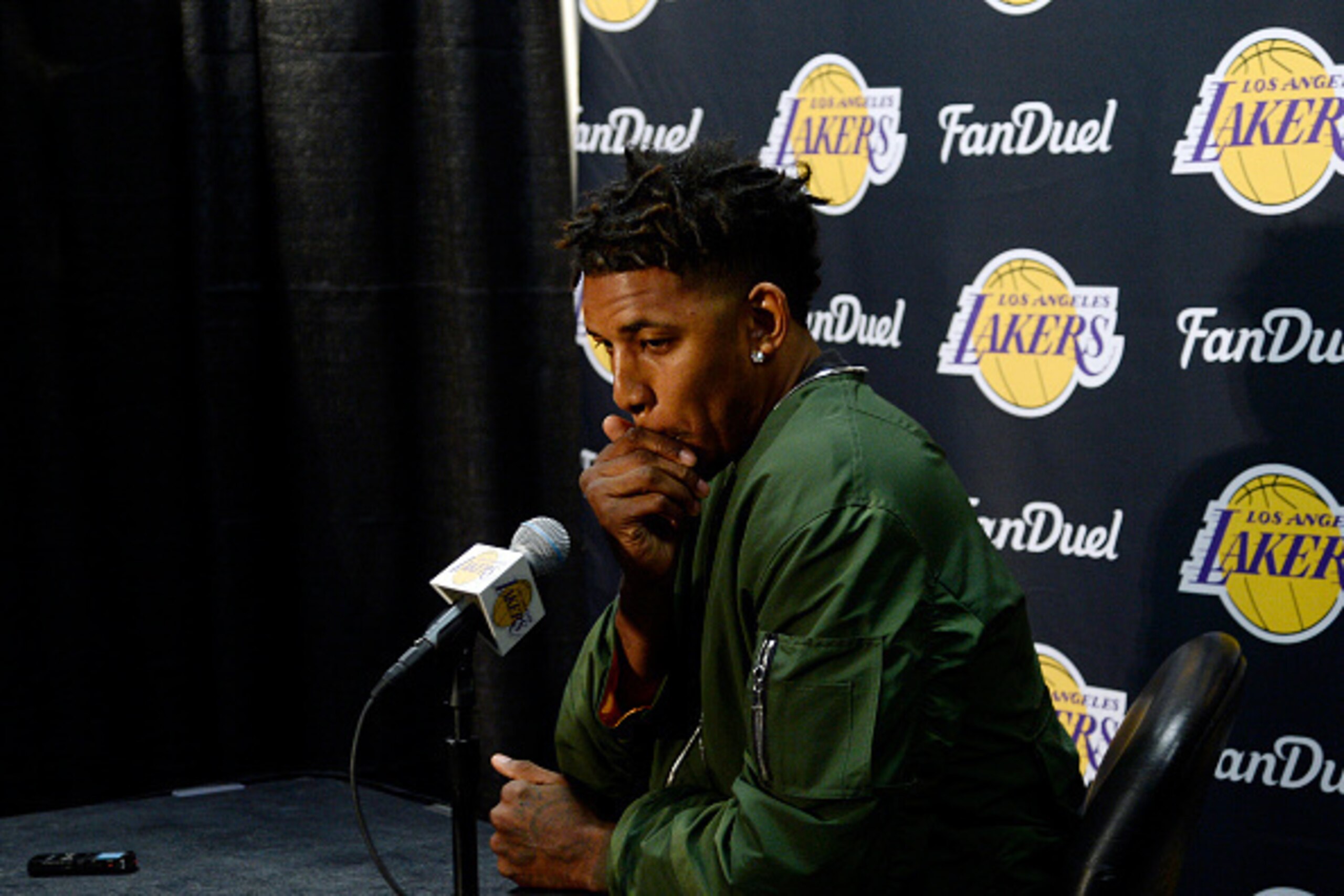 LOS ANGELES, CA - MARCH 30: Nick Young #0 of the Los Angeles Lakers attends a news conference to the discuss the controversy with teammate D'Angelo Russell before the start of the NBA game against the Miami Heat at Staples Center March 30, 2016, in Los An