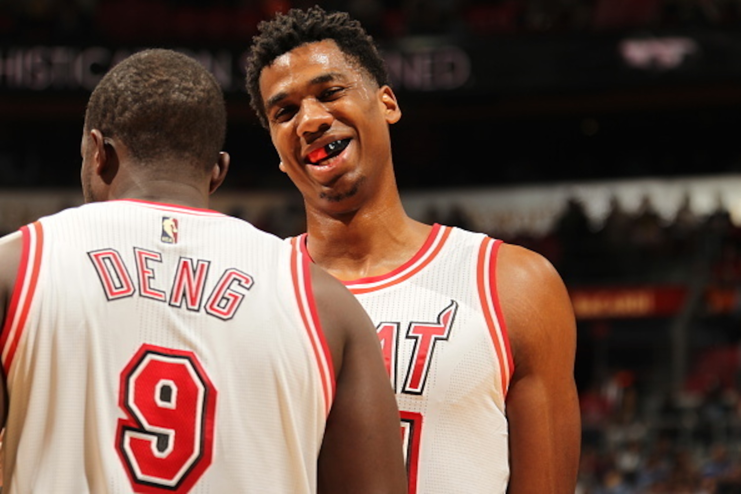 MIAMI, FL - FEBRUARY 24:  Hassan Whiteside #21 of the Miami Heat and Luol Deng #9 of the Miami Heat talk during the game against the Golden State Warriors on February 24, 2016 at American Airlines Arena in Miami, Florida. NOTE TO USER: User expressly ackn