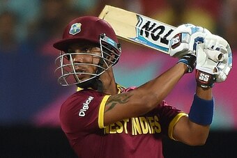 West Indies batsman Lendl Simmons plays a shot during the World T20 cricket tournament semi-final match between India and West Indies at The Wankhede Cricket Stadium in Mumbai on March 31, 2016. / AFP / PUNIT PARANJPE        (Photo credit should read PUNI