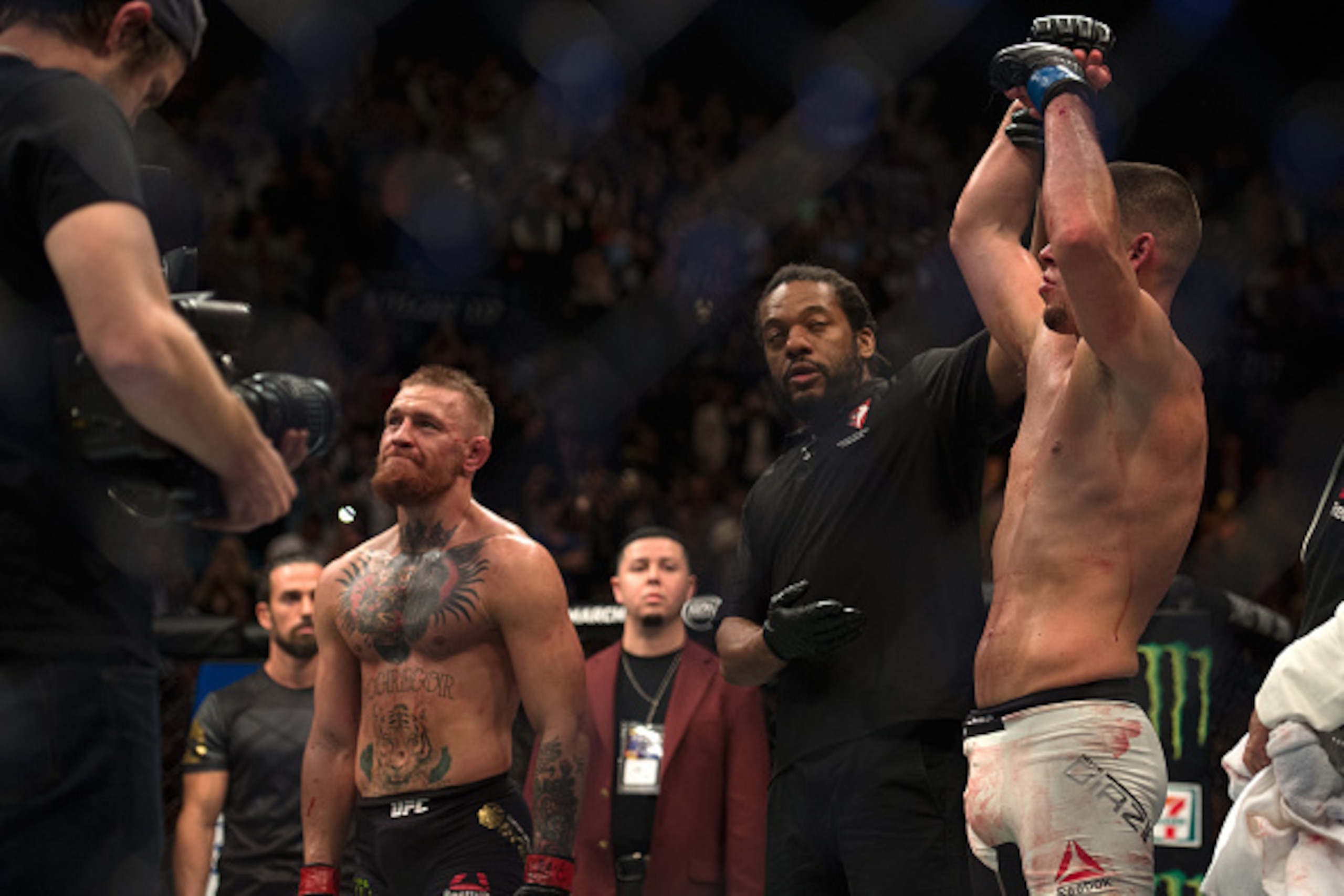LAS VEGAS, NV - MARCH 5:   (R-L) Nate Diaz celebrates his submission victory over Conor McGregor in their welterweight bout during the UFC 196 in the MGM Grand Garden Arena on March 5, 2016 in Las Vegas, Nevada. (Photo by Brandon Magnus/Zuffa LLC/Zuffa LL