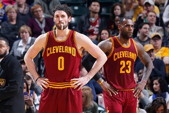 INDIANAPOLIS, IN - FEBRUARY 1: Kevin Love #0 and LeBron James #23 of the Cleveland Cavaliers look on against the Indiana Pacers during the game at Bankers Life Fieldhouse on February 1, 2016 in Indianapolis, Indiana. The Cavaliers defeated the Pacers 111-