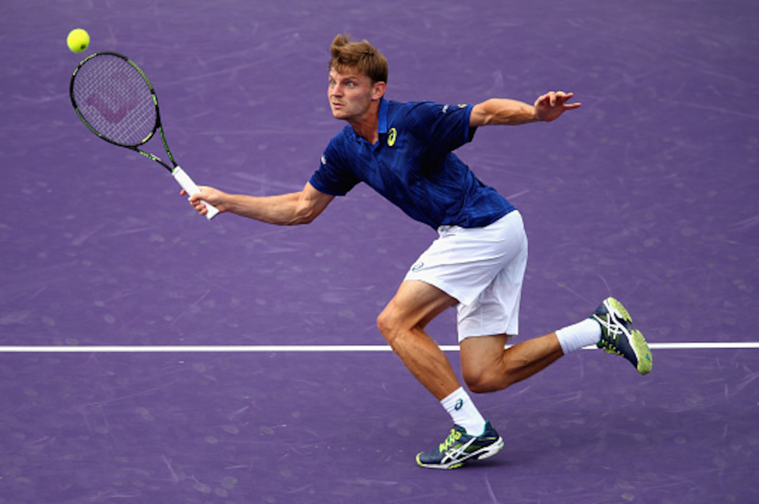 KEY BISCAYNE, FL - MARCH 30:  David Goffin of Belgium plays a forehand against Gilles Simon of France in their quarter final match during the Miami Open Presented by Itau at Crandon Park Tennis Center on March 30, 2016 in Key Biscayne, Florida.  (Photo by