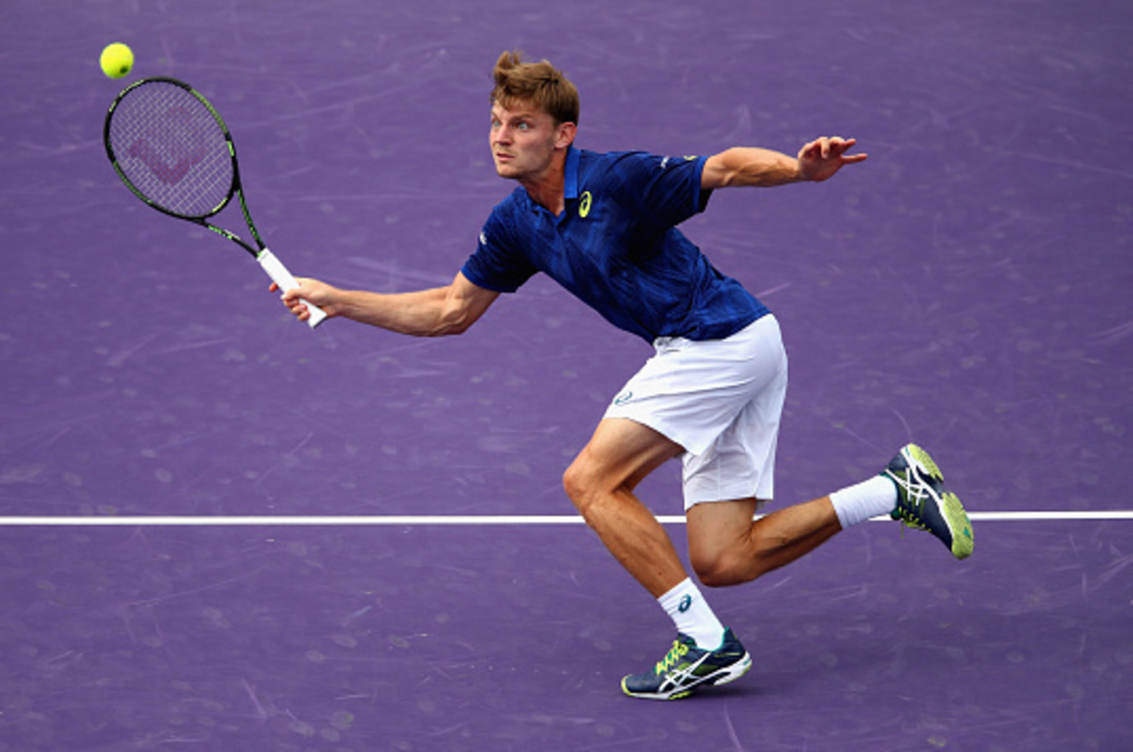 KEY BISCAYNE, FL - MARCH 30:  David Goffin of Belgium plays a forehand against Gilles Simon of France in their quarter final match during the Miami Open Presented by Itau at Crandon Park Tennis Center on March 30, 2016 in Key Biscayne, Florida.  (Photo by