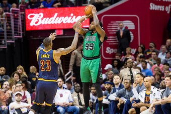 CLEVELAND, OH - FEBRUARY 5: LeBron James #23 of the Cleveland Cavaliers attempts to block Jae Crowder #99 of the Boston Celtics during the first half at Quicken Loans Arena on February 5, 2016 in Cleveland, Ohio. NOTE TO USER: User expressly acknowledges 