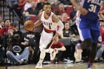 Mar 26, 2016; Portland, OR, USA;  Portland Trail Blazers guard Damian Lillard (0) brings the ball up-court against the Philadelphia 76ers at Moda Center at the Rose Quarter. Mandatory Credit: Jaime Valdez-USA TODAY Sports