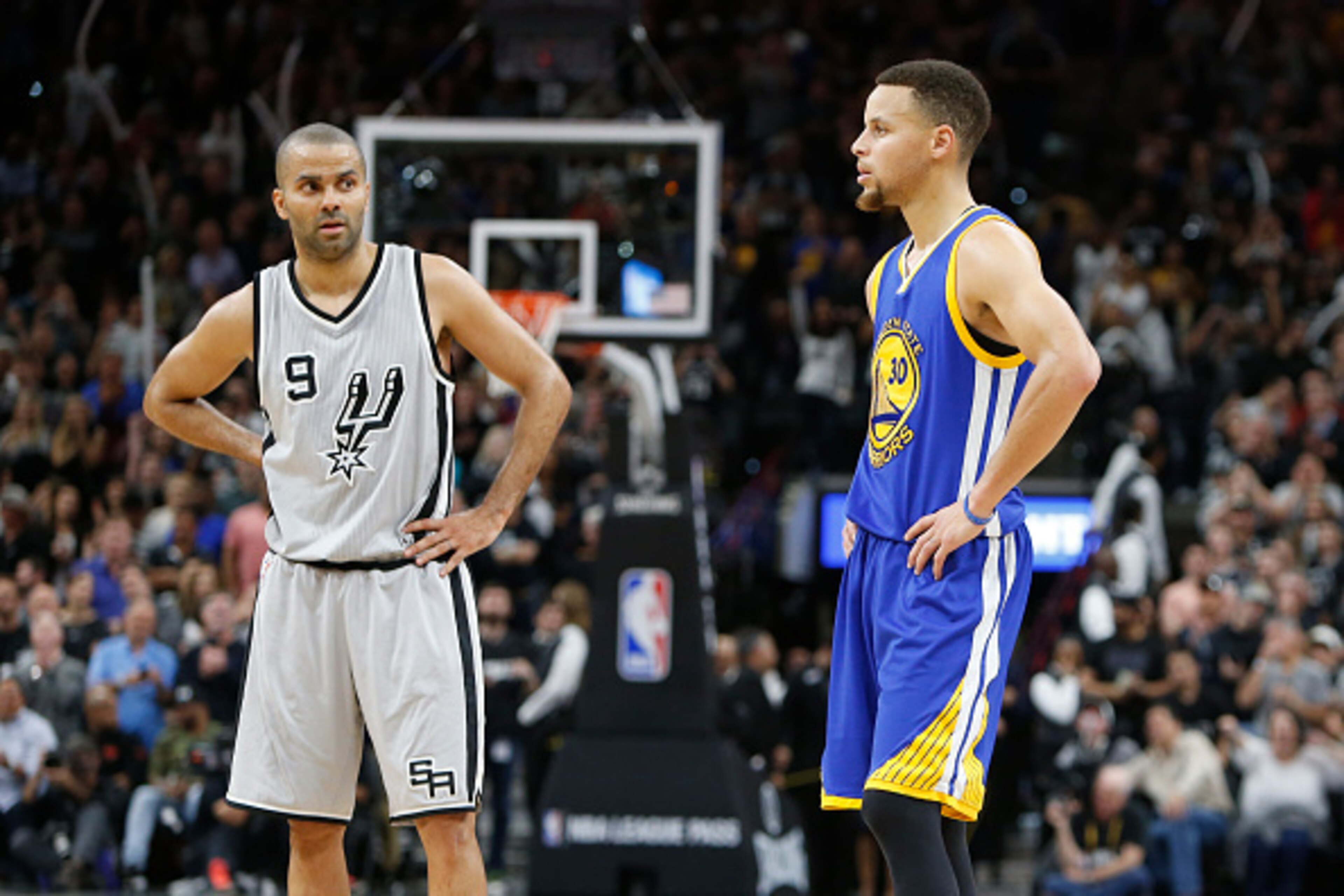 SAN ANTONIO, TX - MARCH 19: As the seconds tick off Tony Parker #9 of the San Antonio Spurs stand next to Stephen Curry #30 of the Golden States Warriors at AT&T Center on March 19, 2016 in San Antonio, Texas.  NOTE TO USER: User expressly acknowledges an