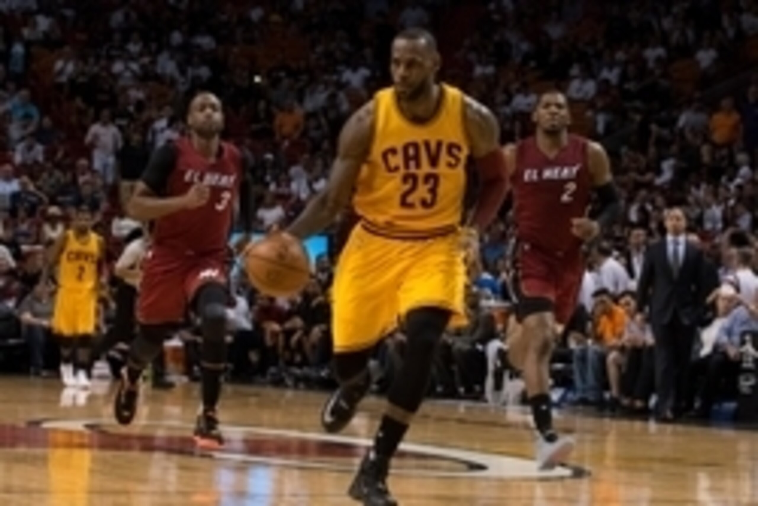 Mar 19, 2016; Miami, FL, USA; Cleveland Cavaliers forward LeBron James (23) dribbles the ball past Miami Heat guard Dwyane Wade (3) during the second half at American Airlines Arena. The Heat won 122-101. Mandatory Credit: Steve Mitchell-USA TODAY Sports