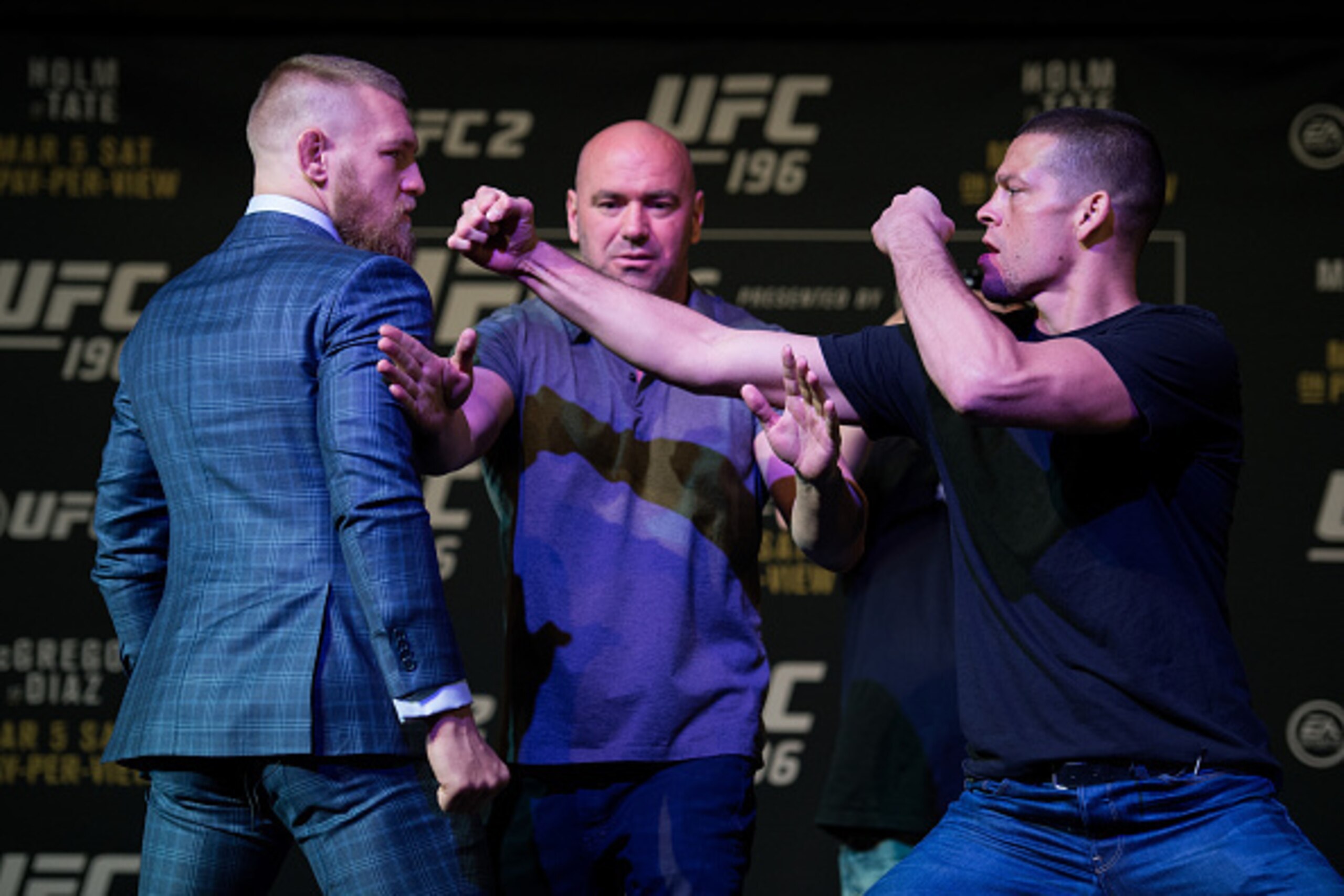 LAS VEGAS, NV - MARCH 3:   (L-R) UFC featherweight champion Conor McGregor and Nate Diaz face off during the UFC 196 Press Conference at David Copperfield Theater in the MGM Grand Hotel/Casino on March 3, 2016 in Las Vegas, Nevada. (Photo by Brandon Magnu