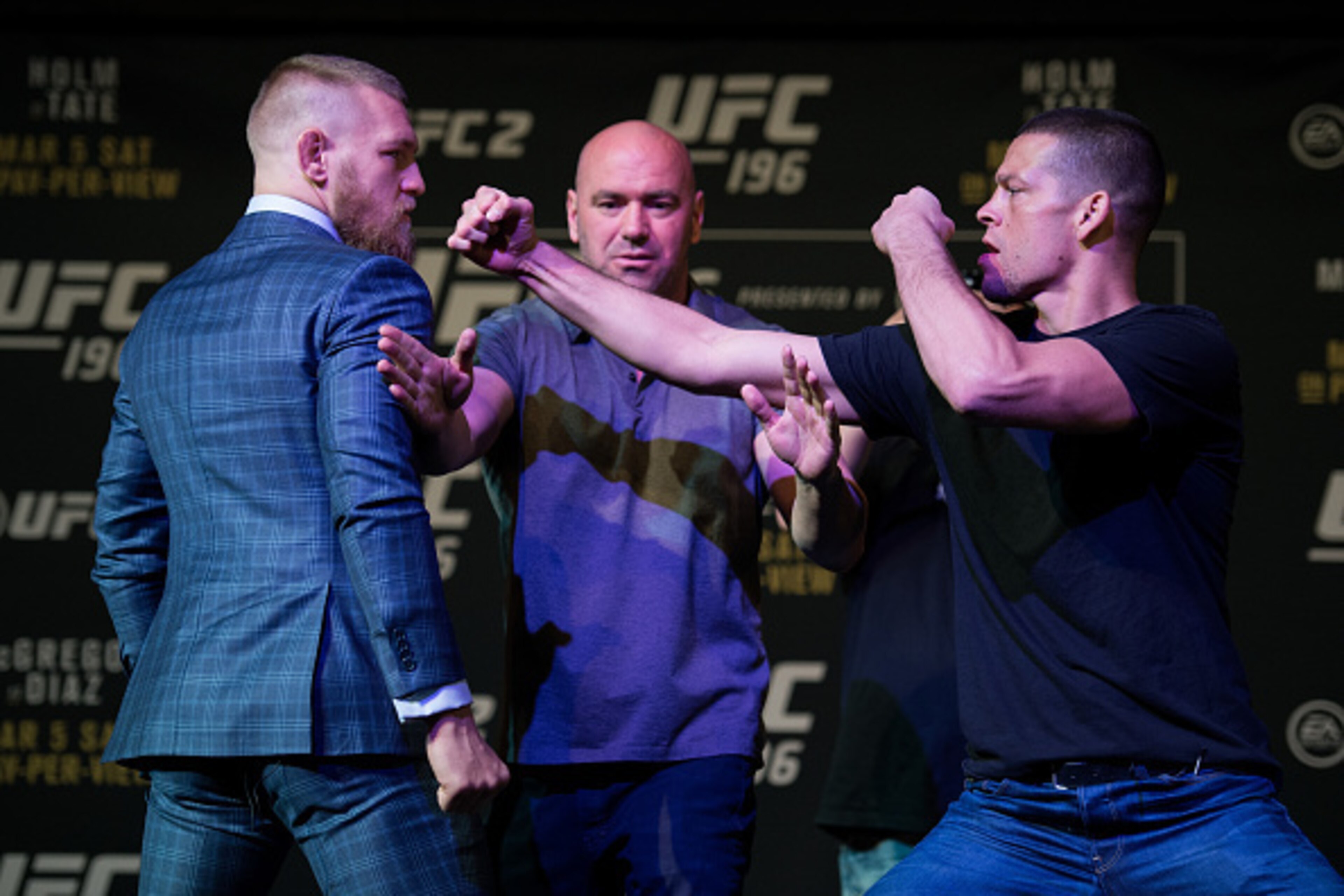 LAS VEGAS, NV - MARCH 3: (L-R) UFC featherweight champion Conor McGregor and Nate Diaz face off during the UFC 196 Press Conference at David Copperfield Theater in the MGM Grand Hotel/Casino on March 3, 2016 in Las Vegas, Nevada. (Photo by Brandon Magnu LAS VEGAS, NV - MARCH 3: (L-R) UFC featherweight champion Conor McGregor and Nate Diaz face off during the UFC 196 Press Conference at David Copperfield Theater in the MGM Grand Hotel/Casino on March 3, 2016 in Las Vegas, Nevada. (Photo by Brandon Magnu