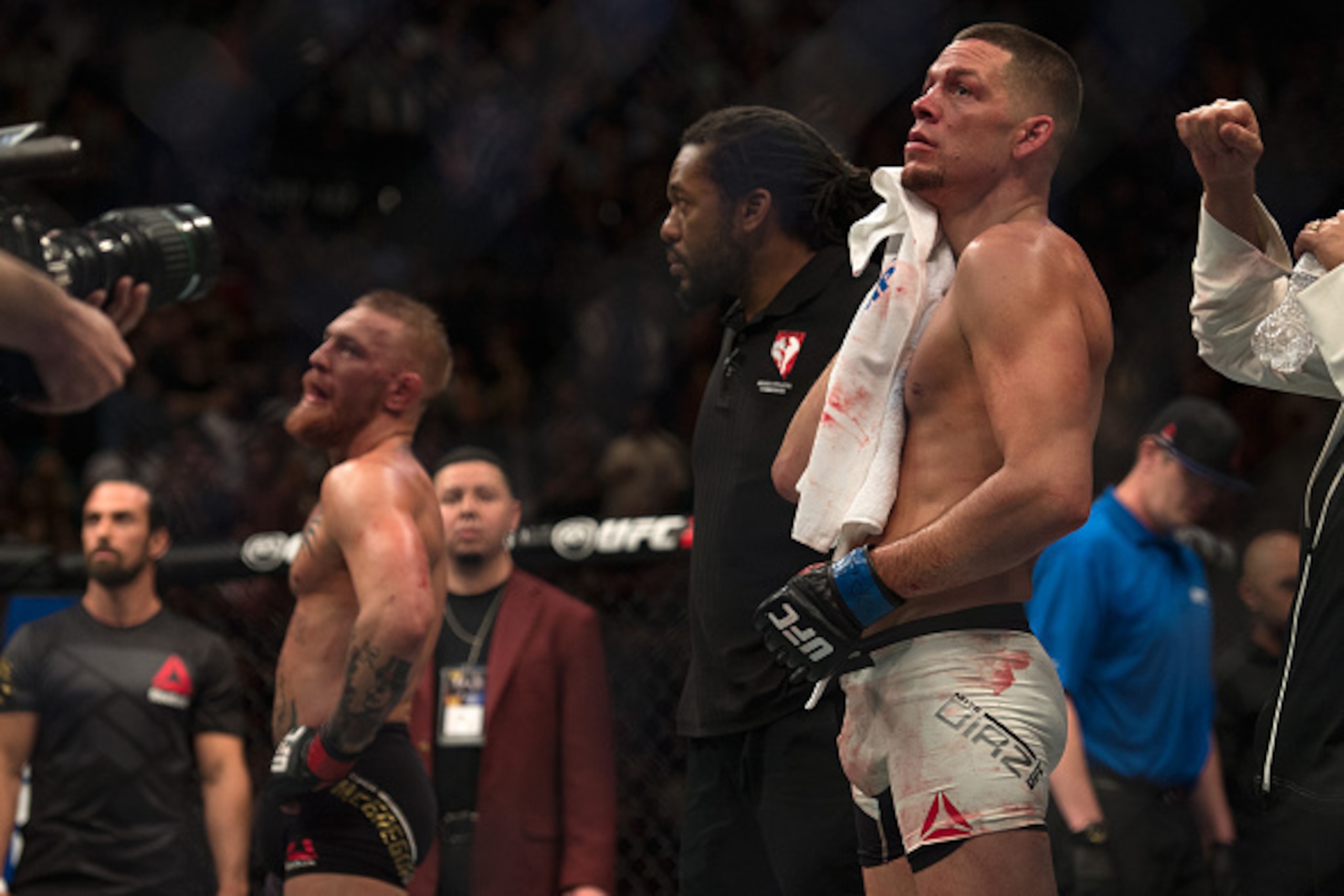 LAS VEGAS, NV - MARCH 5:   (R-L) Nate Diaz celebrates his submission victory over Conor McGregor in their welterweight bout during the UFC 196 in the MGM Grand Garden Arena on March 5, 2016 in Las Vegas, Nevada. (Photo by Brandon Magnus/Zuffa LLC/Zuffa LL