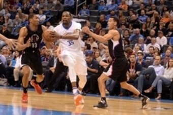 Mar 31, 2016; Oklahoma City, OK, USA; Oklahoma City Thunder forward Kevin Durant (35) drives to the basket between Los Angeles Clippers forward Wesley Johnson (33) and Los Angeles Clippers guard Pablo Prigioni (9) during the fourth quarter at Chesapeake E