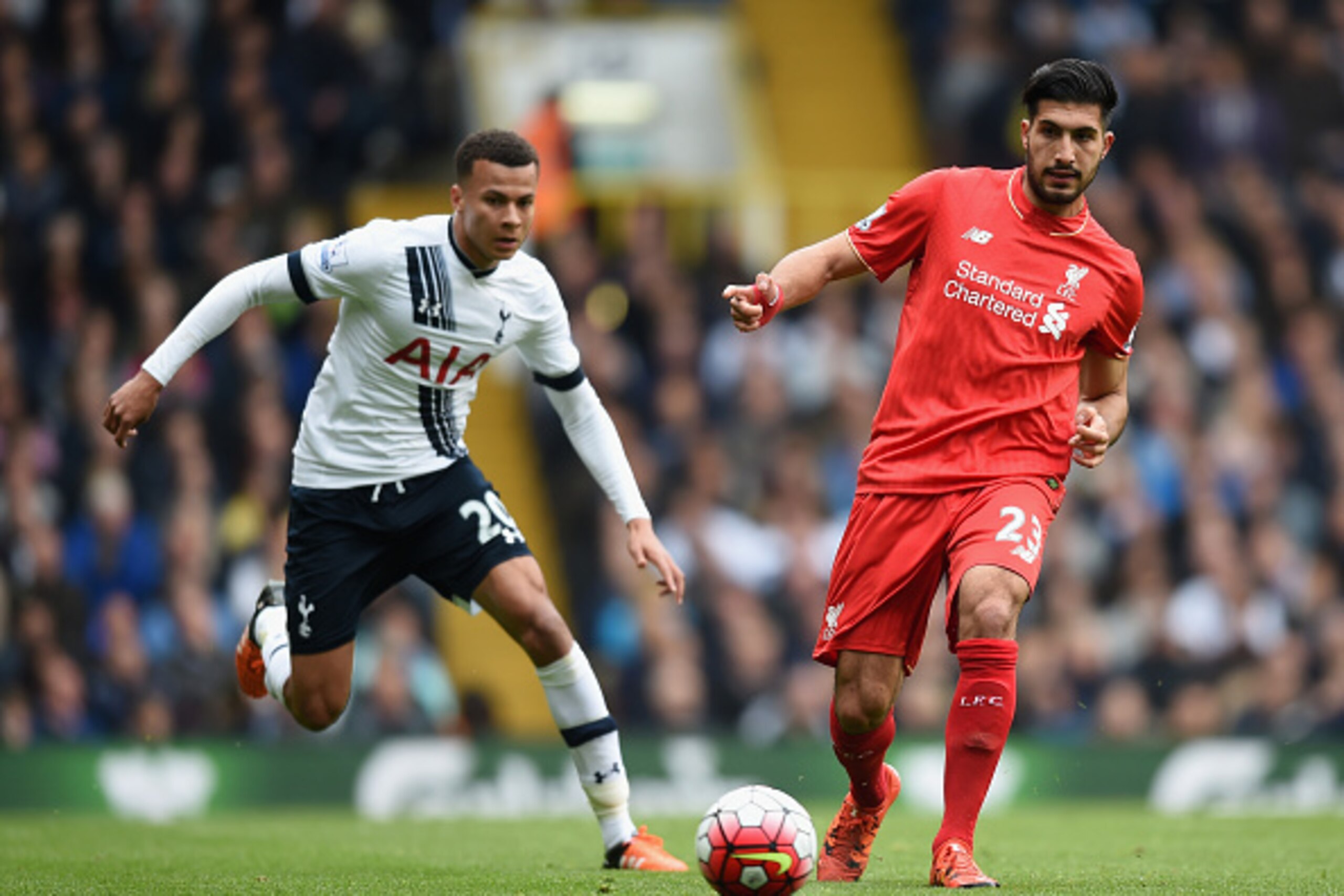 LONDON, ENGLAND - OCTOBER 17: Emre Can of Liverpool and Dele Alli of Tottenham Hotspur compete for the ball during the Barclays Premier League match between Tottenham Hotspur and Liverpool at White Hart Lane on October 17, 2015 in London, England.  (Photo