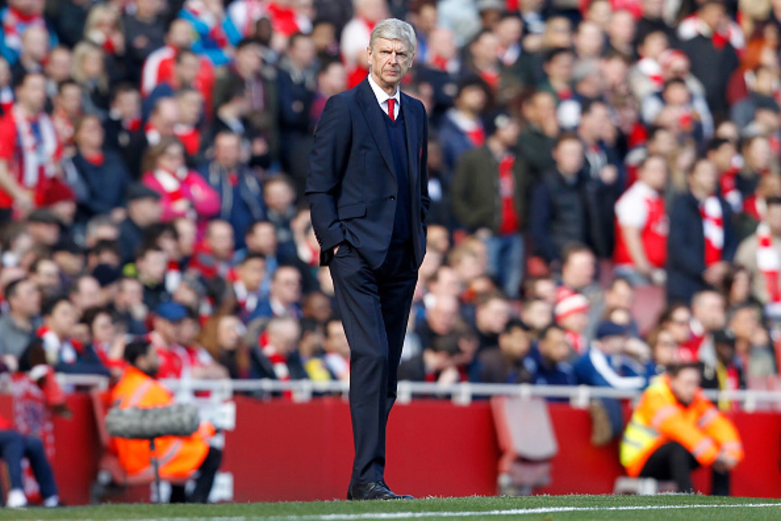 Arsenal's French manager Arsene Wenger watches his players from the touchline during the FA Cup quarter final football match between Arsenal and Watford at the Emirates Stadium in London on March 13, 2016.  / AFP / Ian Kington / RESTRICTED TO EDITORIAL US