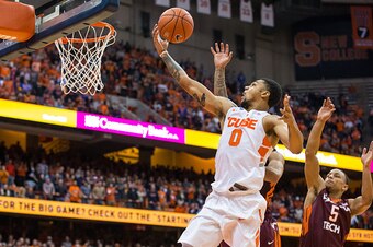 SYRACUSE, NY - FEBRUARY 02:  Michael Gbinije #0 of the Syracuse Orange shoots the ball during overtime against the Virginia Tech Hokies on February 2, 2016 at The Carrier Dome in Syracuse, New York.  Syracuse defeats Virginia Tech 68-60 in overtime.  (Pho