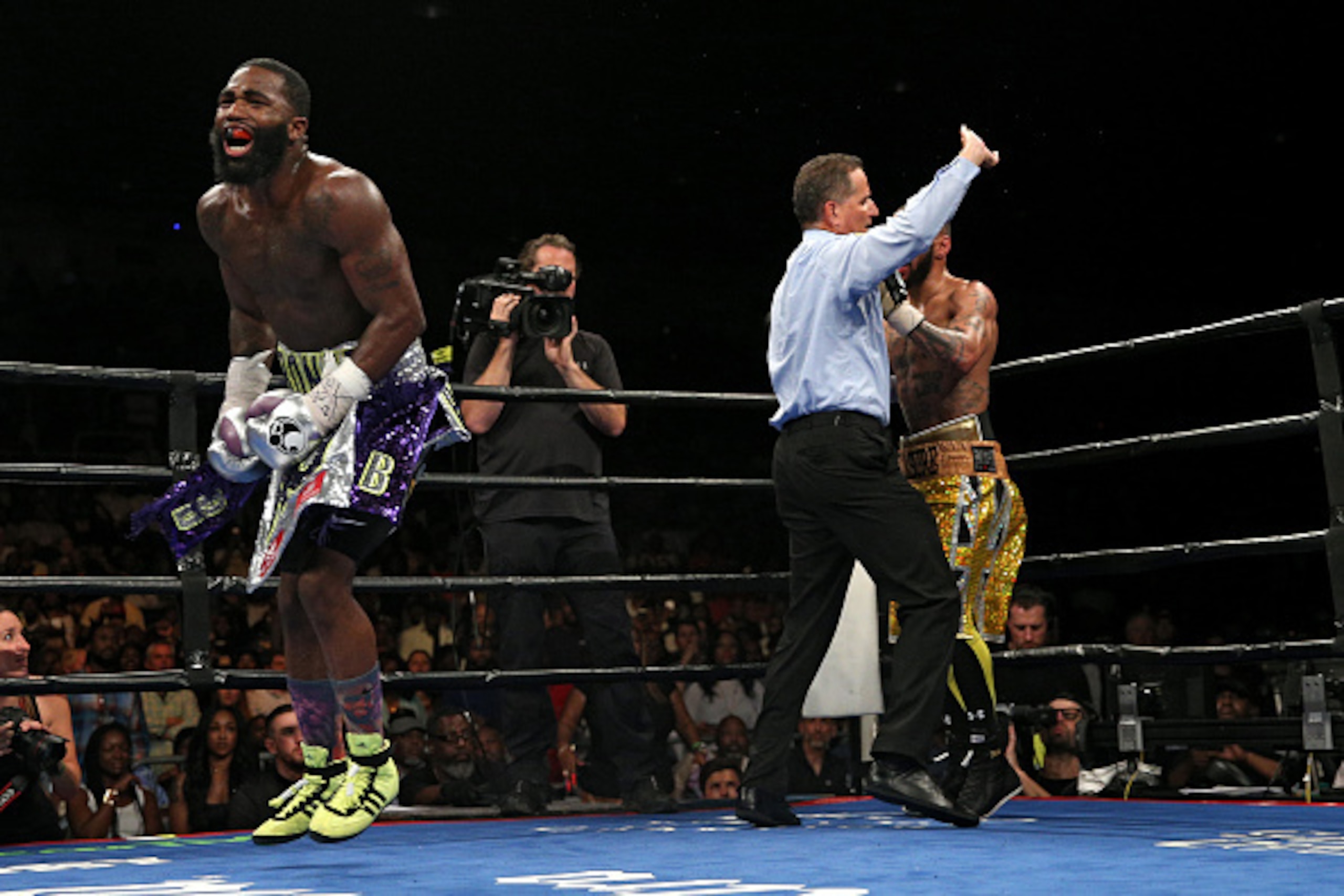 WASHINGTON, DC - APRIL 01: Adrien Broner (L) reacts after defeating Ashley Theophane (R) by TKO in ninth round in their super lightweight championship bout at the DC Armory on April 1, 2016 in Washington, DC. (Photo by Patrick Smith/Getty Images)