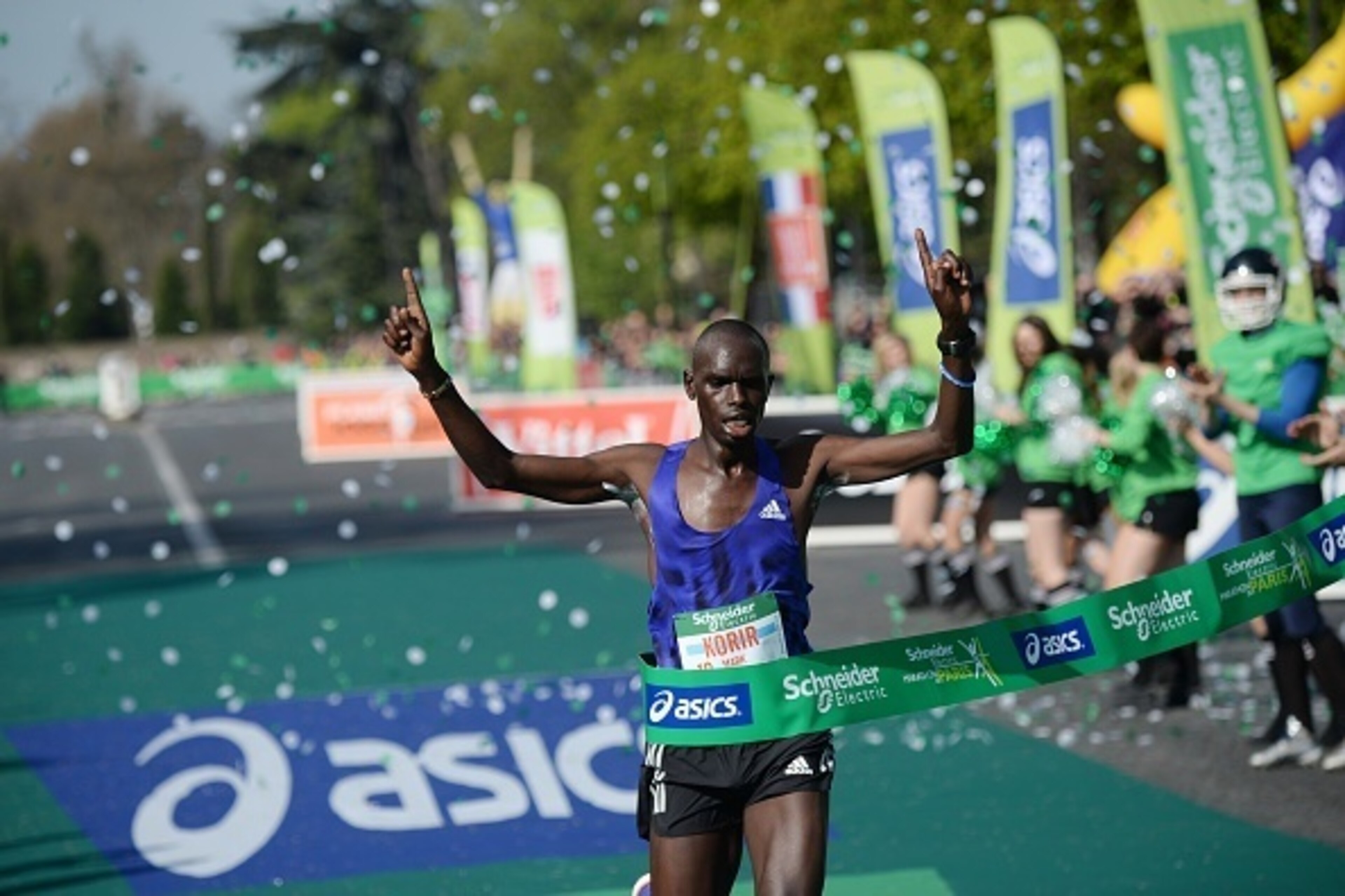 Mark Korir of Kenya crosses the finish line to win the 39th Paris Marathon in Paris on April 12, 2015.  AFP PHOTO / STEPHANE DE SAKUTIN        (Photo credit should read STEPHANE DE SAKUTIN/AFP/Getty Images)