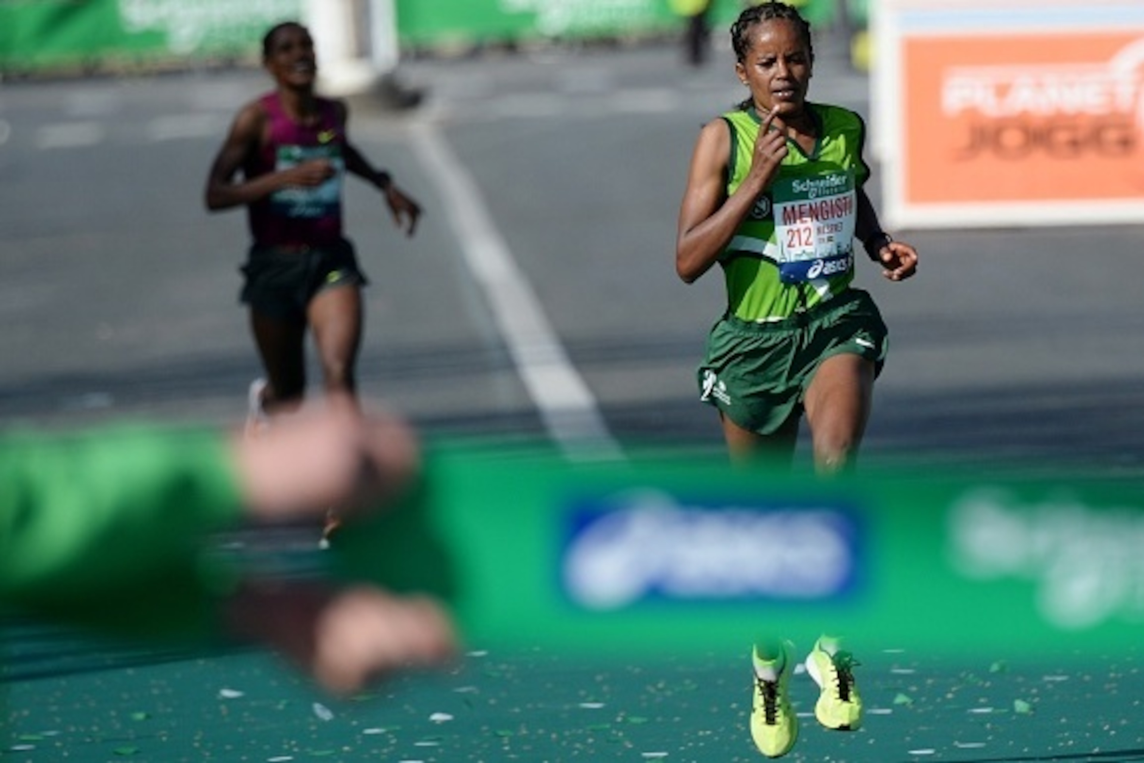 Meseret Mengistu of Ethiopia runs towards the finish line in the 39th Paris Marathon in Paris on April 12, 2015.   Mark Korir of Kenya won the Paris Marathon, his first career victory in a prestigious international race. Korir, 30, who was second in last 