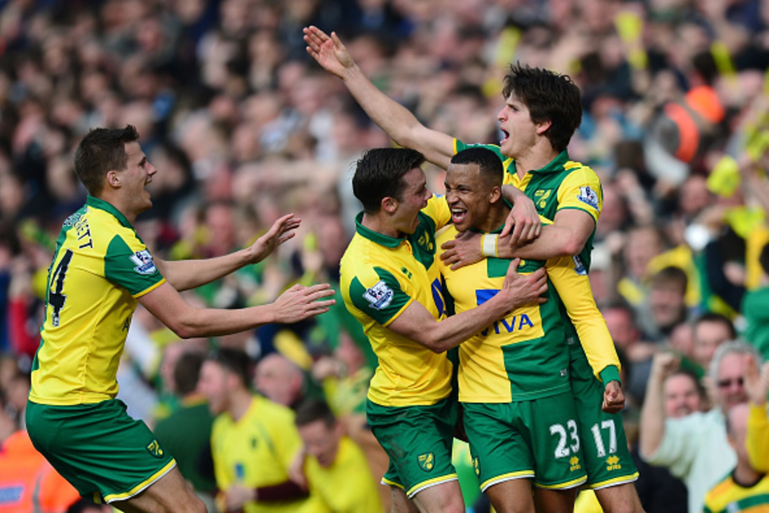 NORWICH, ENGLAND - APRIL 02:  Martin Olsson (2nd R) of Norwich City celebrates scoring his team's third goal with his team mates during the Barclays Premier League match between Norwich City and Newcastle United at Carrow Road on April 2, 2016 in Norwich,