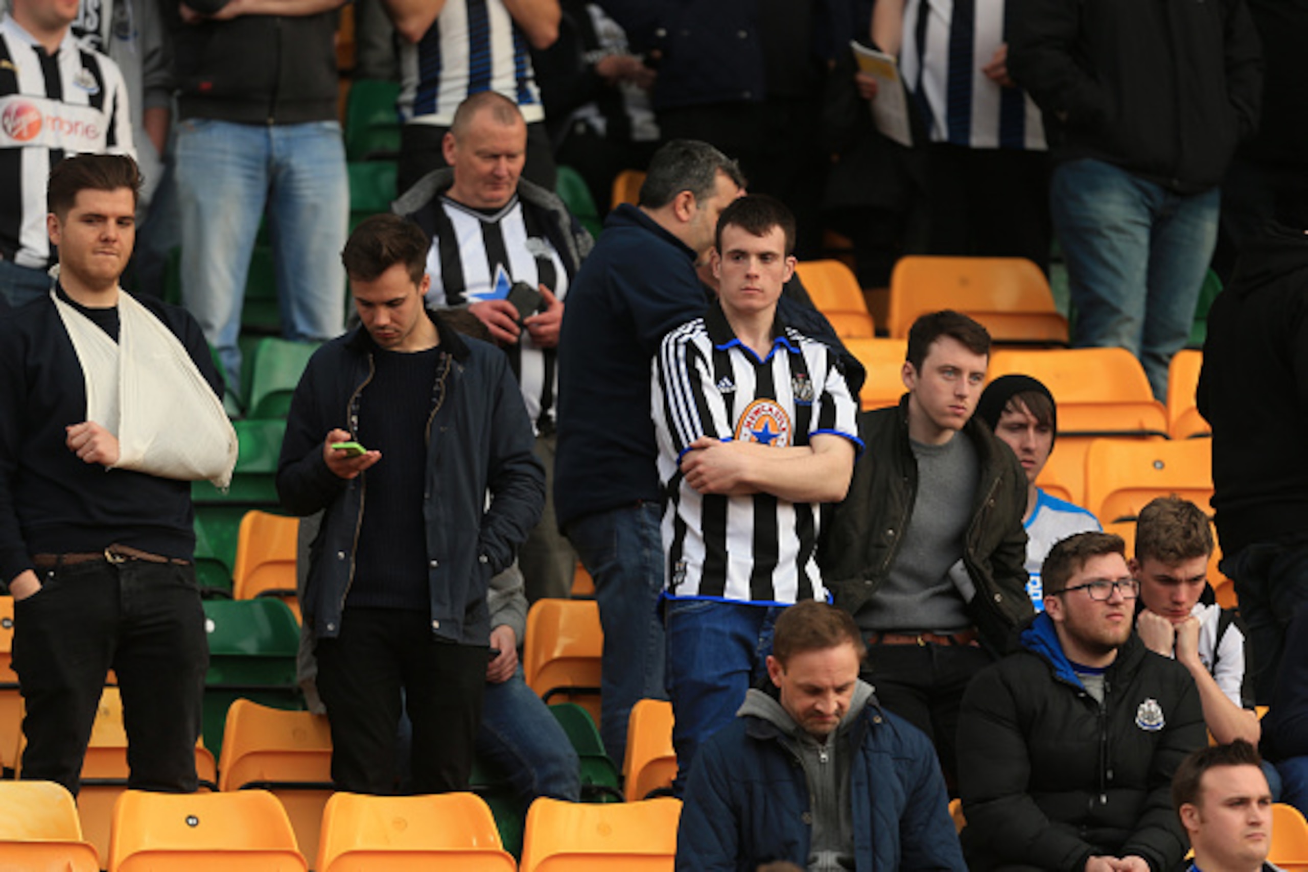 NORWICH, ENGLAND - APRIL 02:  Frustrated Newcastle United supporters are seen on the stand after the Barclays Premier League match between Norwich City and Newcastle United at Carrow Road on April 2, 2016 in Norwich, England.  (Photo by Stephen Pond/Getty