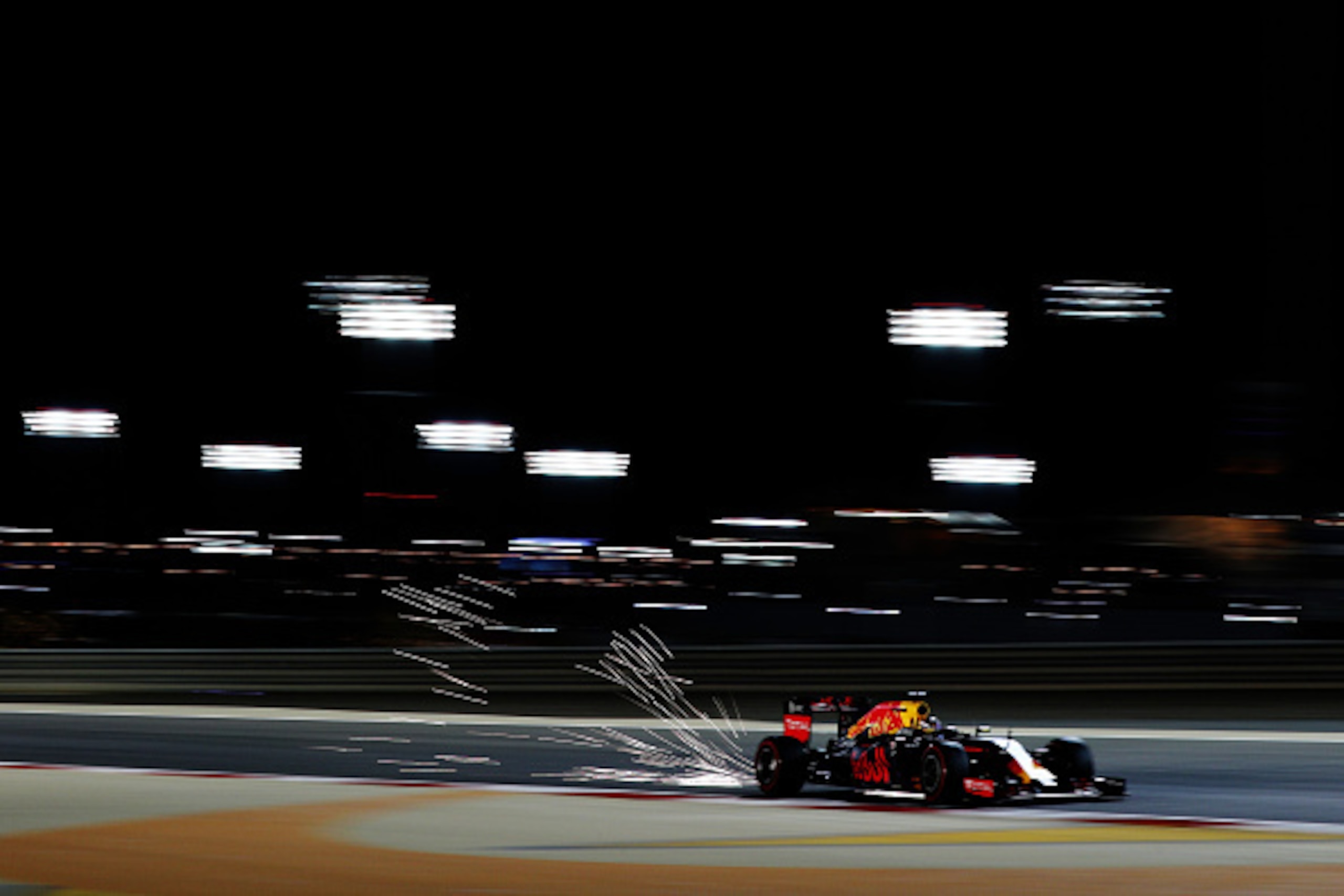 SAKHIR, BAHRAIN - APRIL 02: Daniel Ricciardo of Australia drives the (3) Red Bull Racing Red Bull-TAG Heuer RB12 TAG Heuer on track with sparks behind him during qualifying for the Bahrain Formula One Grand Prix at Bahrain International Circuit on April 2