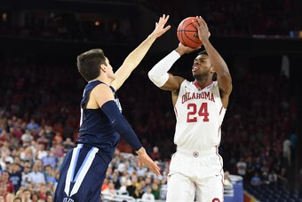 Apr 2, 2016; Houston, TX, USA; Oklahoma Sooners guard Buddy Hield (24) shoots over Villanova Wildcats guard Ryan Arcidiacono (15) in the first half  in the 2016 NCAA Men's Division I Championship semi-final game at NRG Stadium. Mandatory Credit: Robert De
