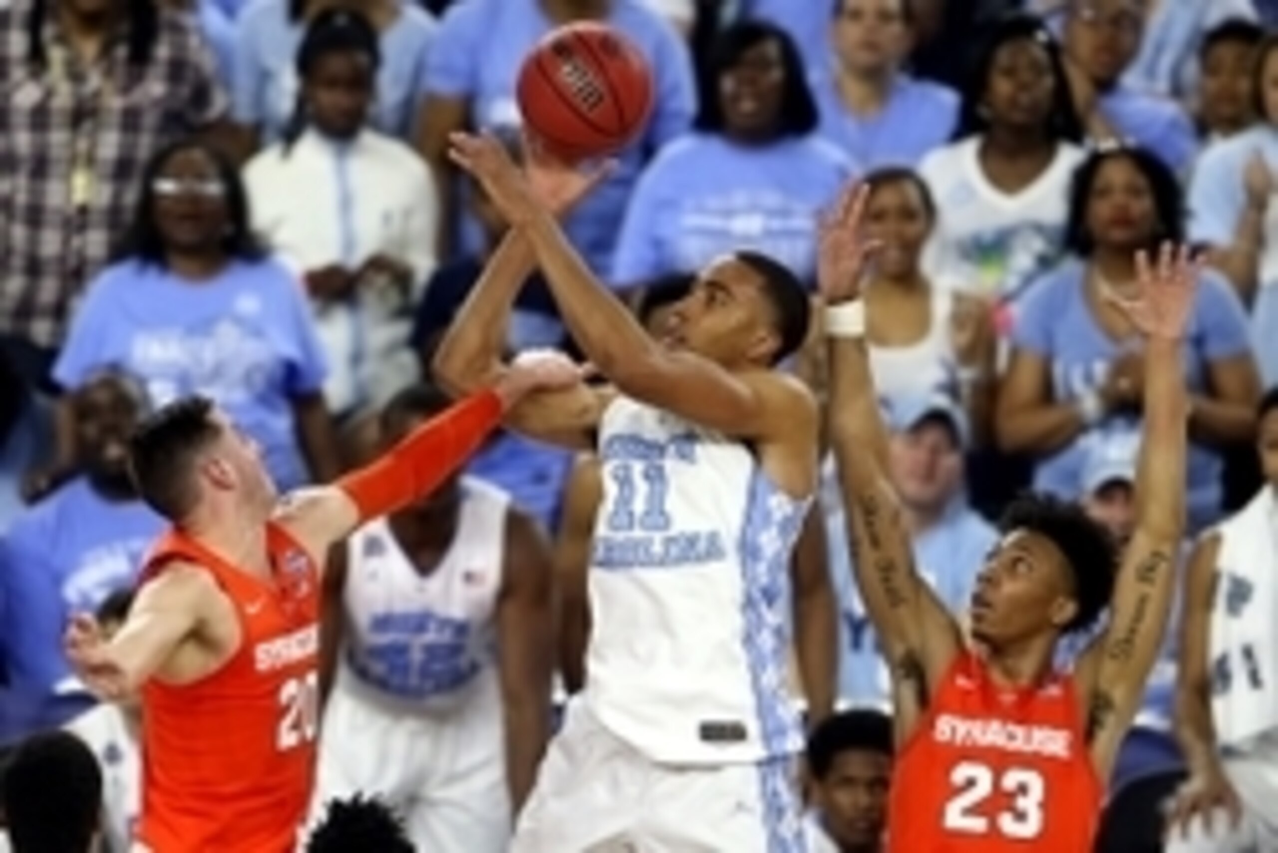 Apr 2, 2016; Houston, TX, USA; North Carolina Tar Heels forward Brice Johnson (11) shoots the ball against Syracuse Orange forward Tyler Lydon (20) and guard Malachi Richardson (23) during the second half in the 2016 NCAA Men's Division I Championship sem
