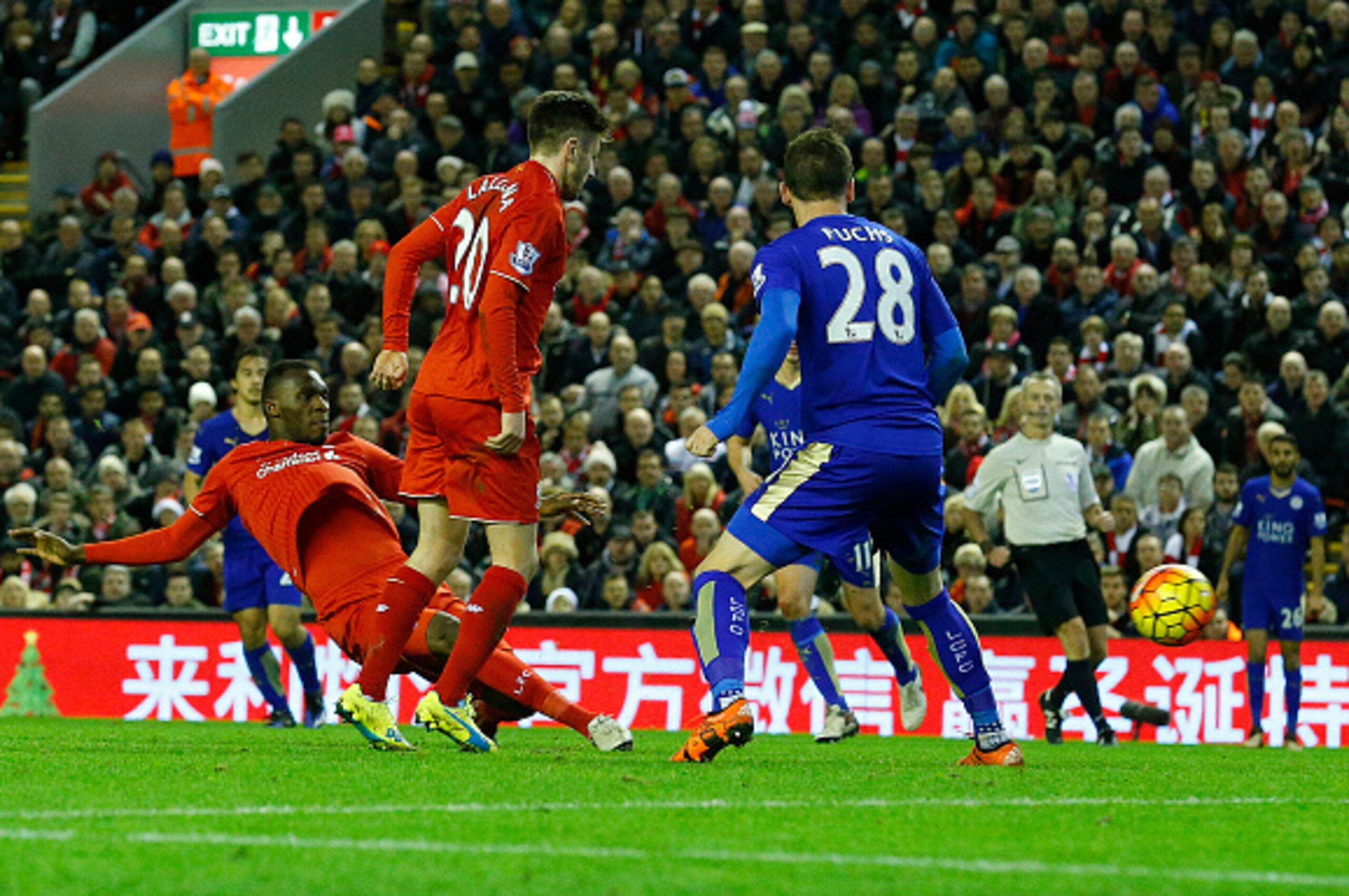 Liverpool's Zaire-born Belgian striker Christian Benteke (L) scores the opening goal during the English Premier League football match between Liverpool and Leicester City at the Anfield stadium in Liverpool, north-west England on December 26, 2015.  AFP P