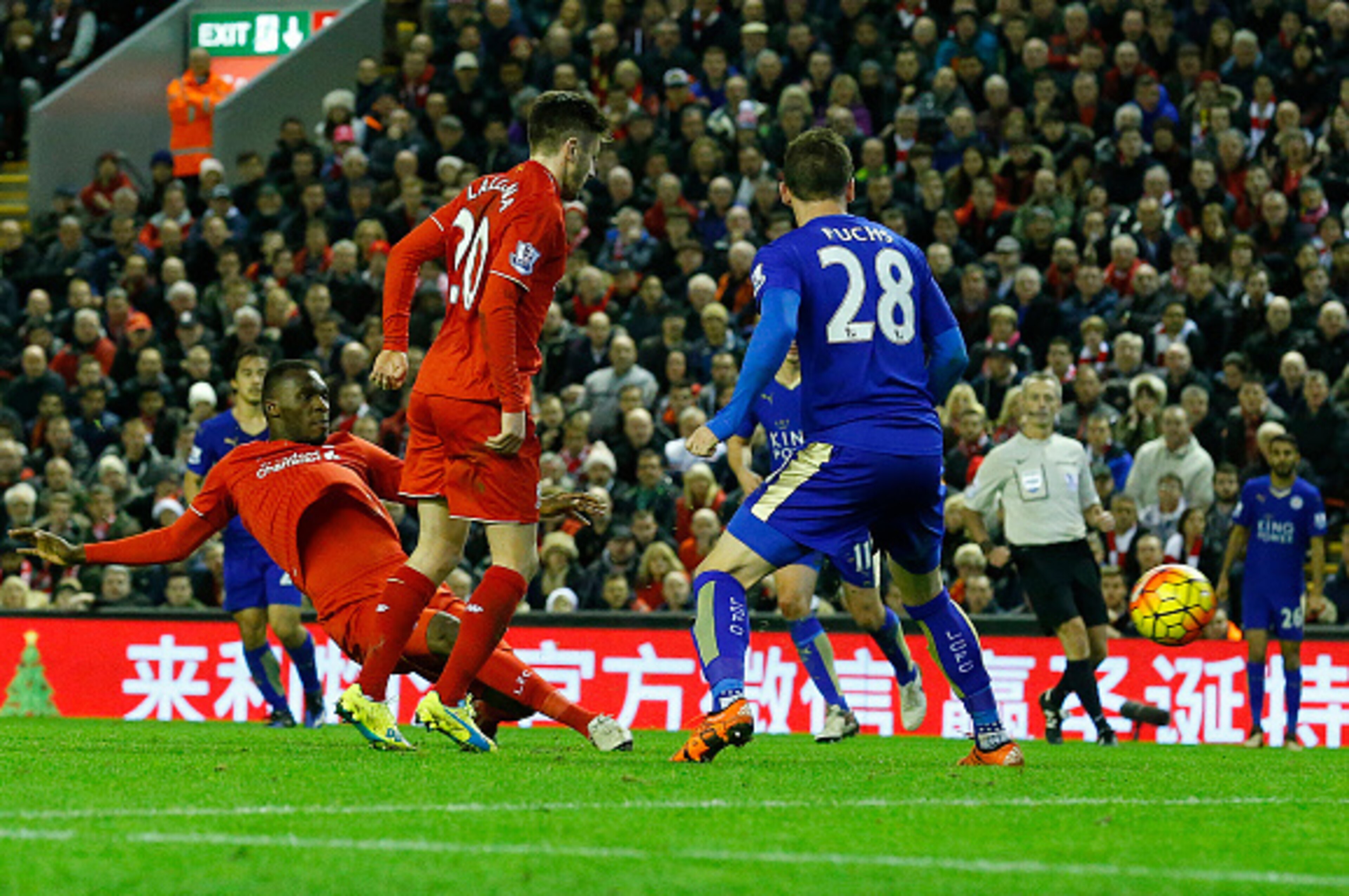 Liverpool's Zaire-born Belgian striker Christian Benteke (L) scores the opening goal during the English Premier League football match between Liverpool and Leicester City at the Anfield stadium in Liverpool, north-west England on December 26, 2015.  AFP P