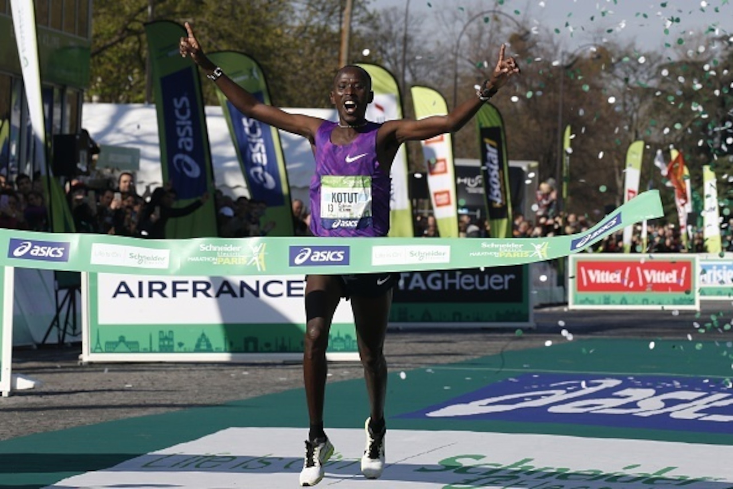 Kenyan Cyprien Kotut passes the finish line as he wins the 40th Paris Marathon, on April 3, 2016 in Paris. Some 57,000 participants from 160 countries have registered with the race covering 42,195km, starting on the Champs Elysees and crossing the French 