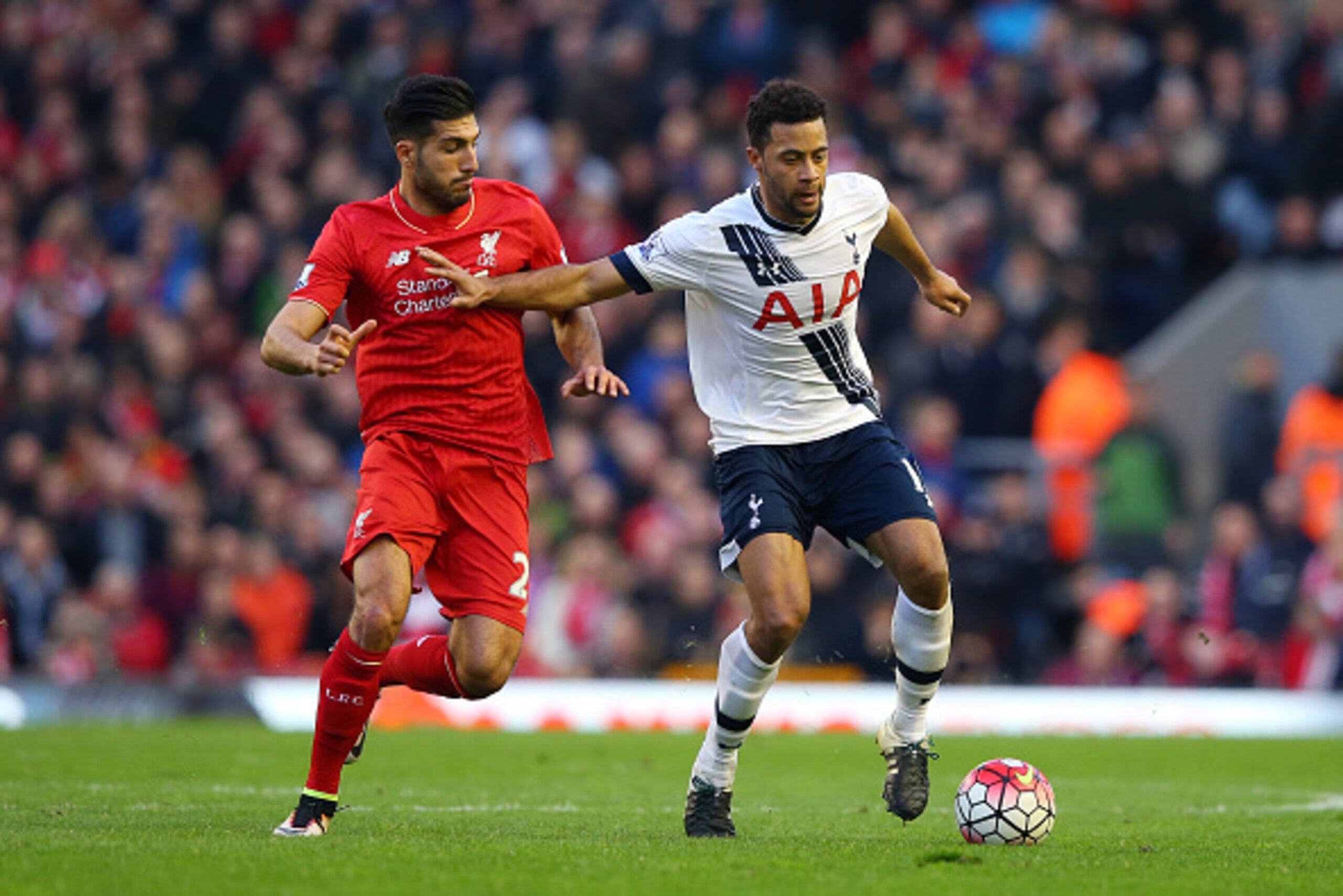 LIVERPOOL, ENGLAND - APRIL 02: Mousa Dembele of Tottenham Hotspur and Emre Can of Liverpool compete for the ball during the Barclays Premier League match between Liverpool and Tottenham Hotspur at Anfield on April 2, 2016 in Liverpool, England.  (Photo by