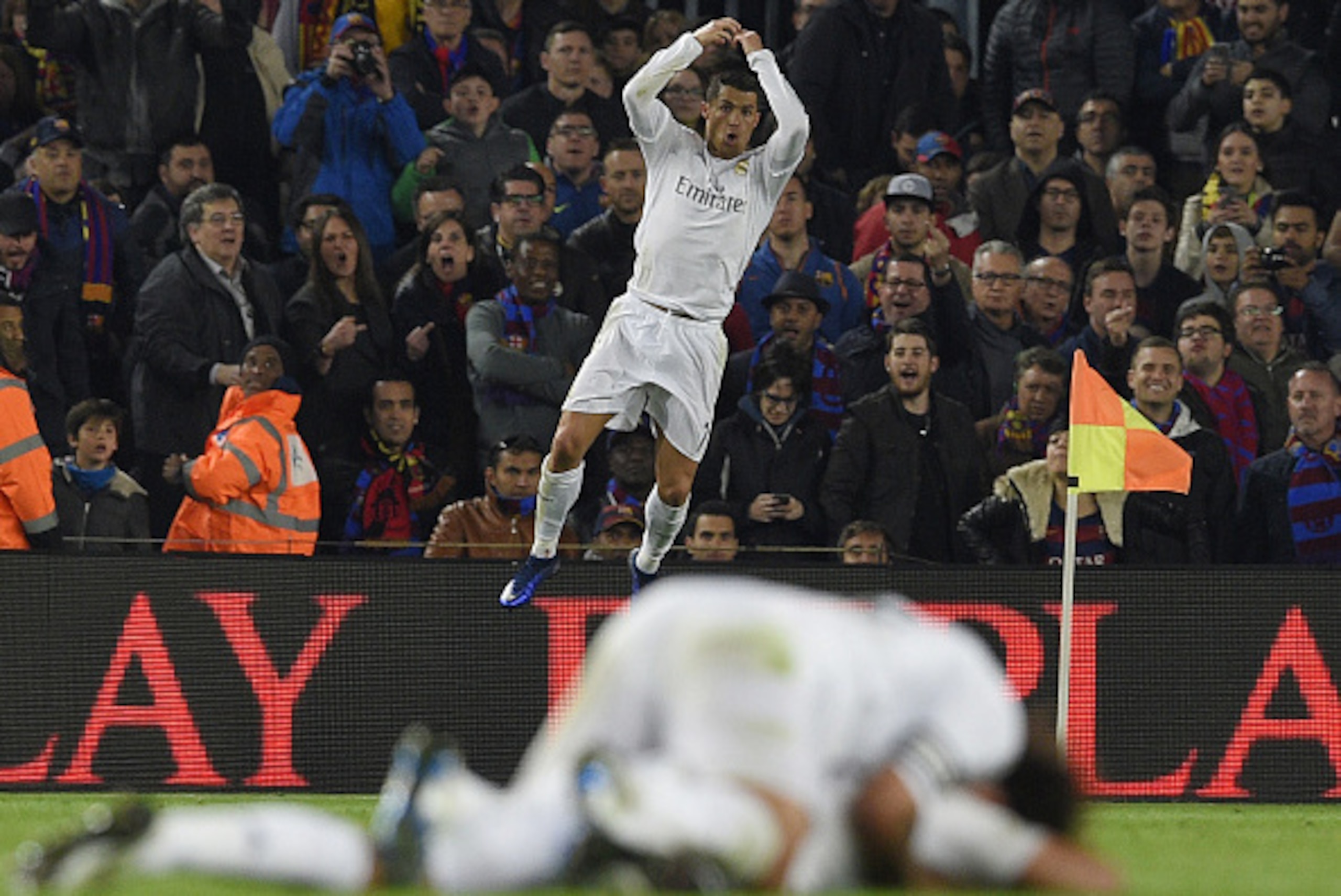 Real Madrid's Portuguese forward Cristiano Ronaldo celebrates after scoring a goal during the Spanish league 'Clasico' football match FC Barcelona vs Real Madrid CF at the Camp Nou stadium in Barcelona on April 2, 2016. / AFP / LLUIS GENE        (Photo cr