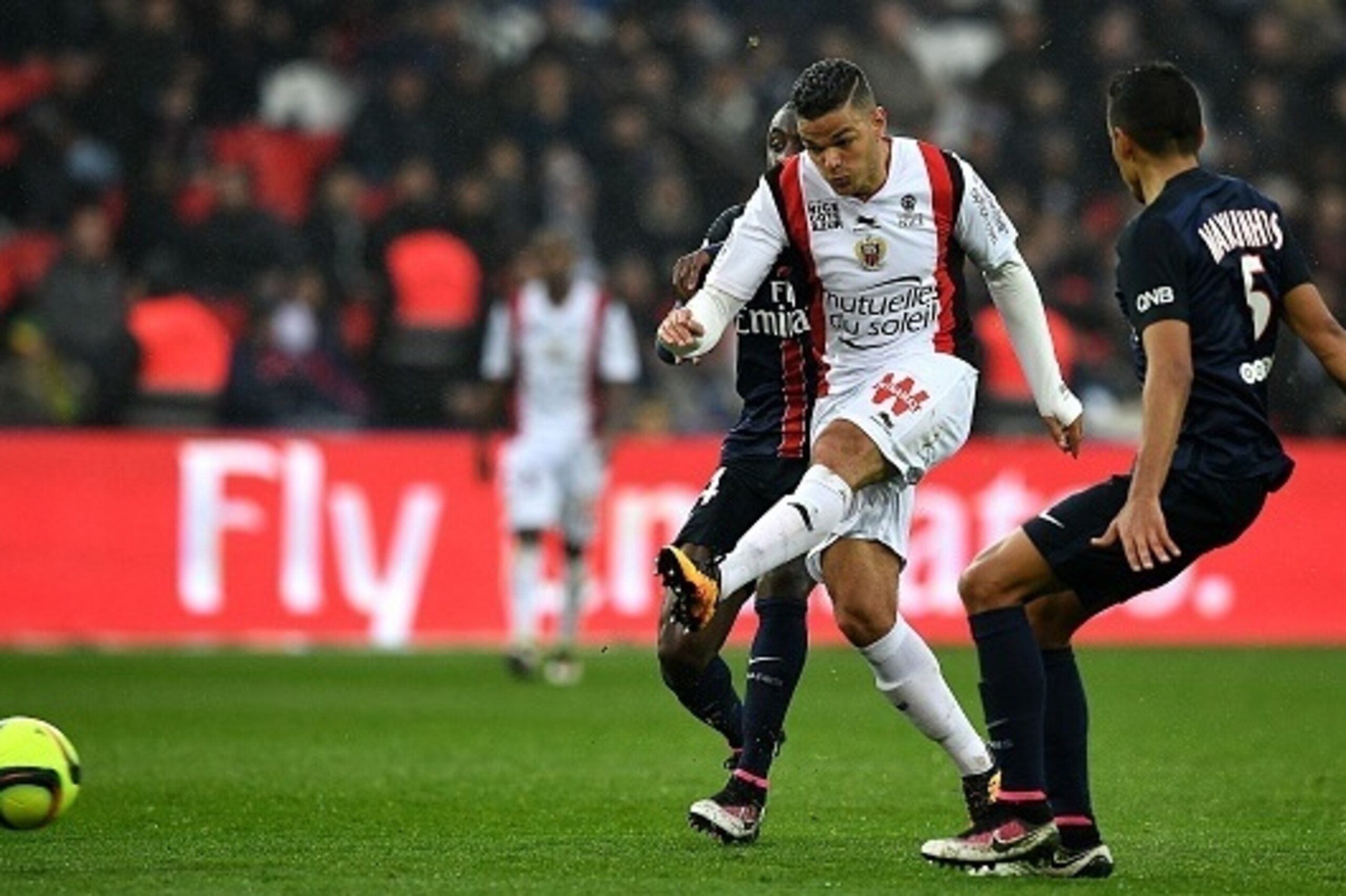 Nice's French forward Hatem Ben Arfa (C) kicks the ball next to Paris Saint-Germain's Brazilian defender Marquinhos (R) during the French L1 football match between Paris Saint-Germain and Nice at the Parc des Princes stadium in Paris on April 2, 2016.  AF