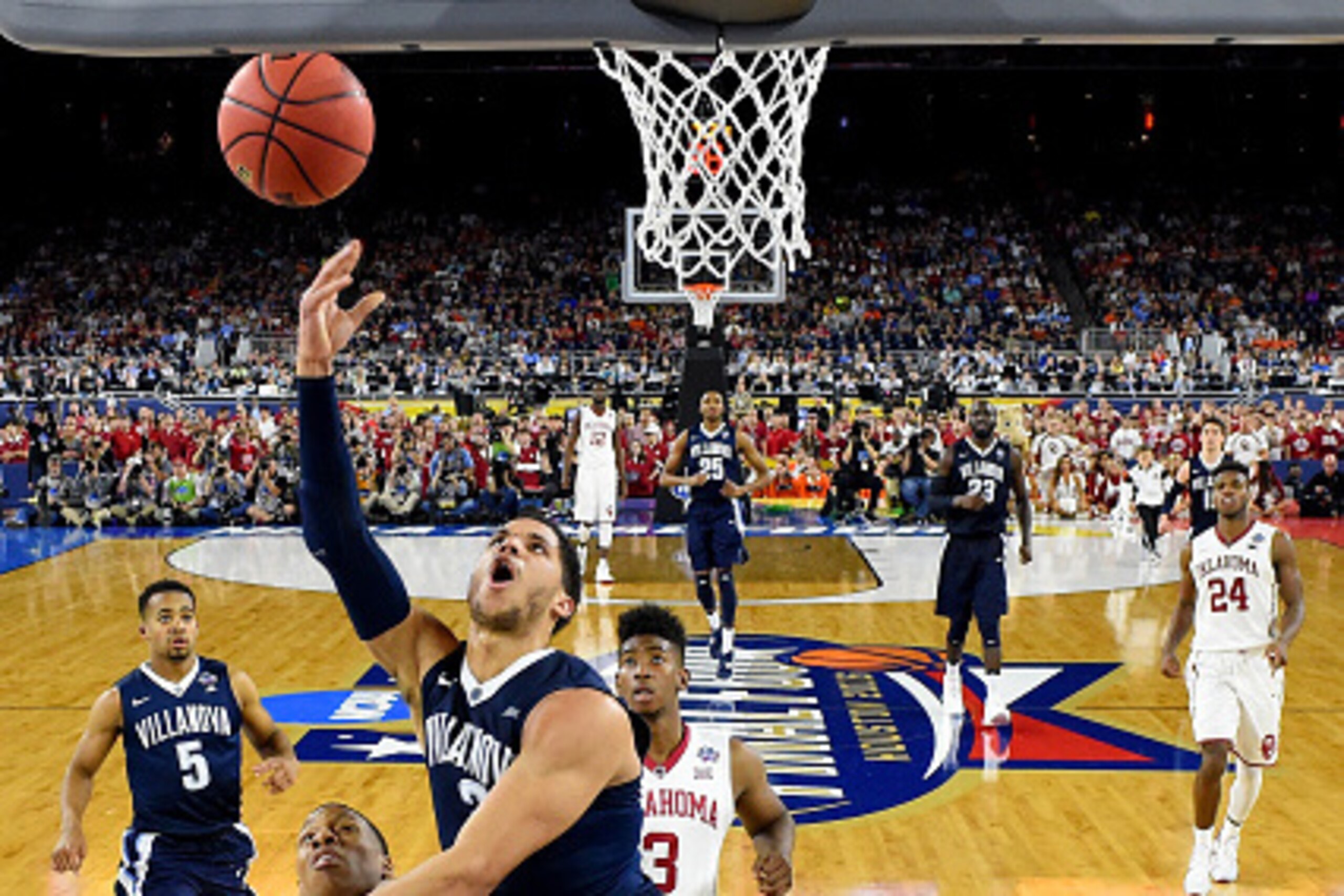 HOUSTON, TEXAS - APRIL 02:  Josh Hart #3 of the Villanova Wildcats shoots the ball against Dinjiyl Walker #2 of the Oklahoma Sooners in the second half during the NCAA Men's Final Four Semifinal at NRG Stadium on April 2, 2016 in Houston, Texas.  (Photo b