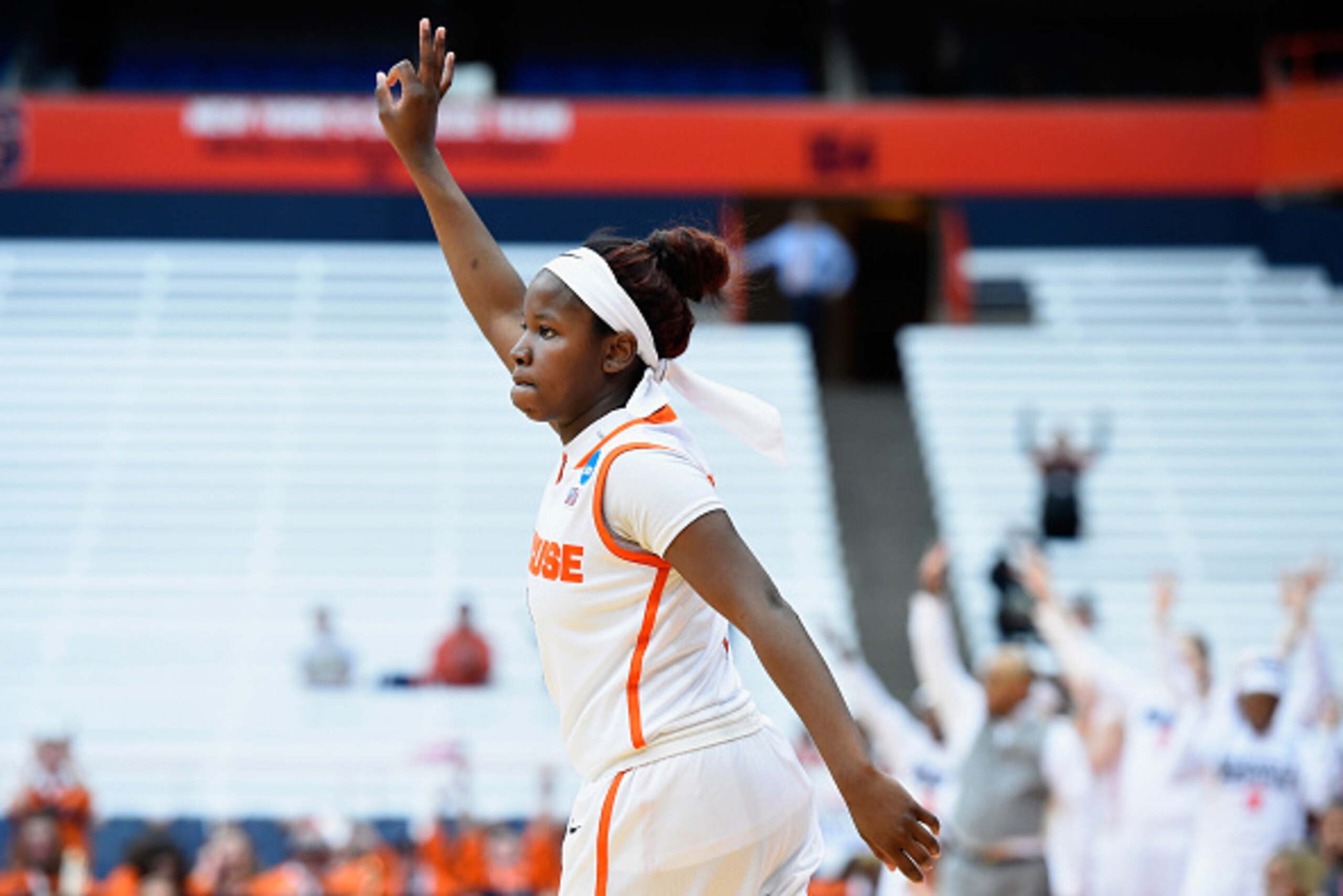 SYRACUSE, NY - MARCH 20:  Alexis Peterson #1 of the Syracuse Orange reacts to a made three-point basket against the Albany Great Danes during the first half in the second round of the 2016 NCAA Women's Basketball Tournament at the Carrier Dome on March 20