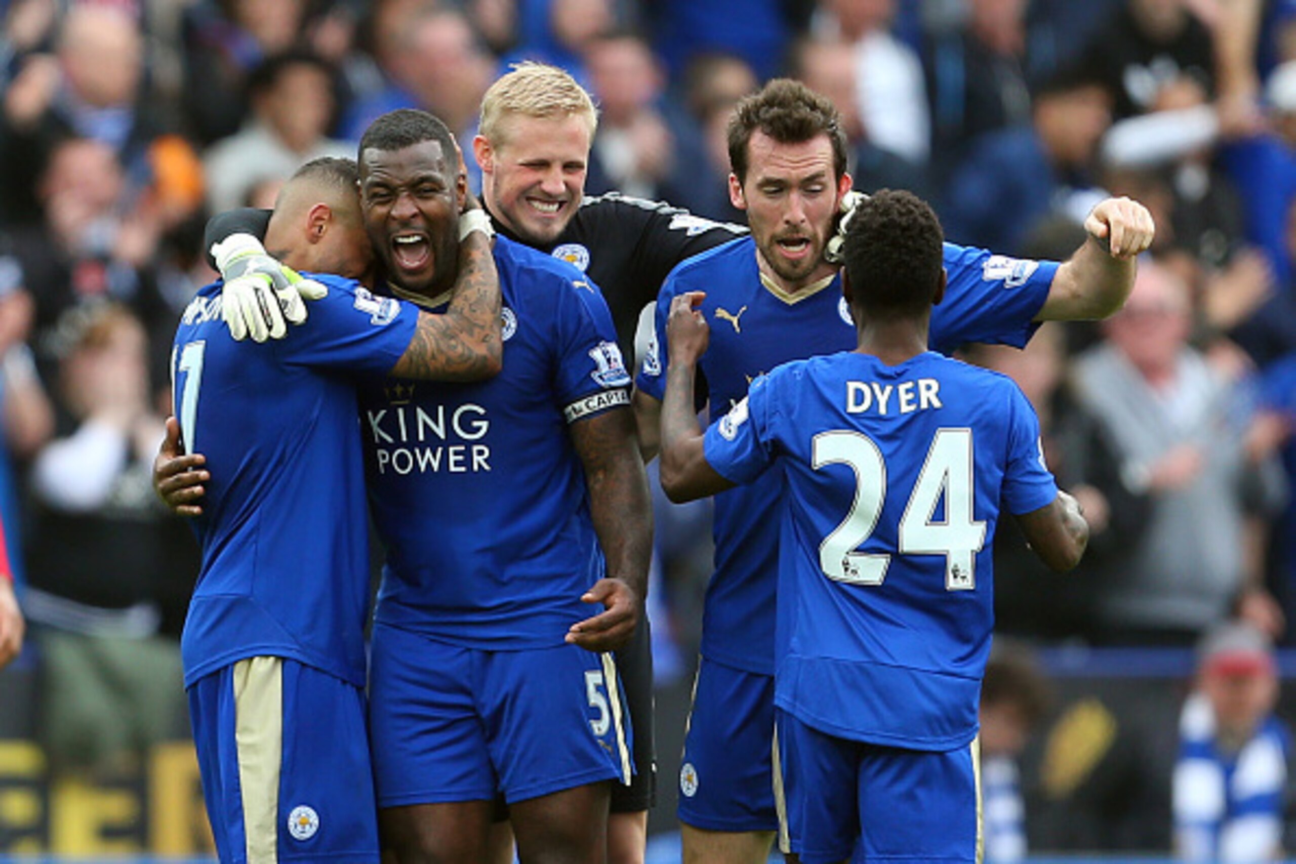 LEICESTER, ENGLAND - APRIL 03: Goalscorer Wes Morgan of Leicester City celebrates with his team mates Danny Simpson, Kasper Schmeichel, Christian Fuchs and Nathan Dyer of Leicester City at the end of the Barclays Premier League match between Leicester Cit