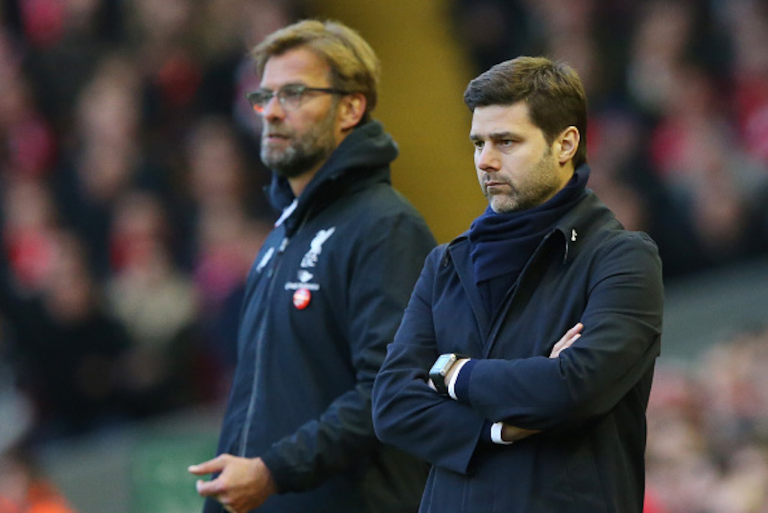 LIVERPOOL, ENGLAND - APRIL 02:  Jurgen Klopp, manager of Liverpool and Mauricio Pochettino Manager of Tottenham Hotspur look on during the Barclays Premier League match between Liverpool and Tottenham Hotspur at Anfield on April 2, 2016 in Liverpool, Engl