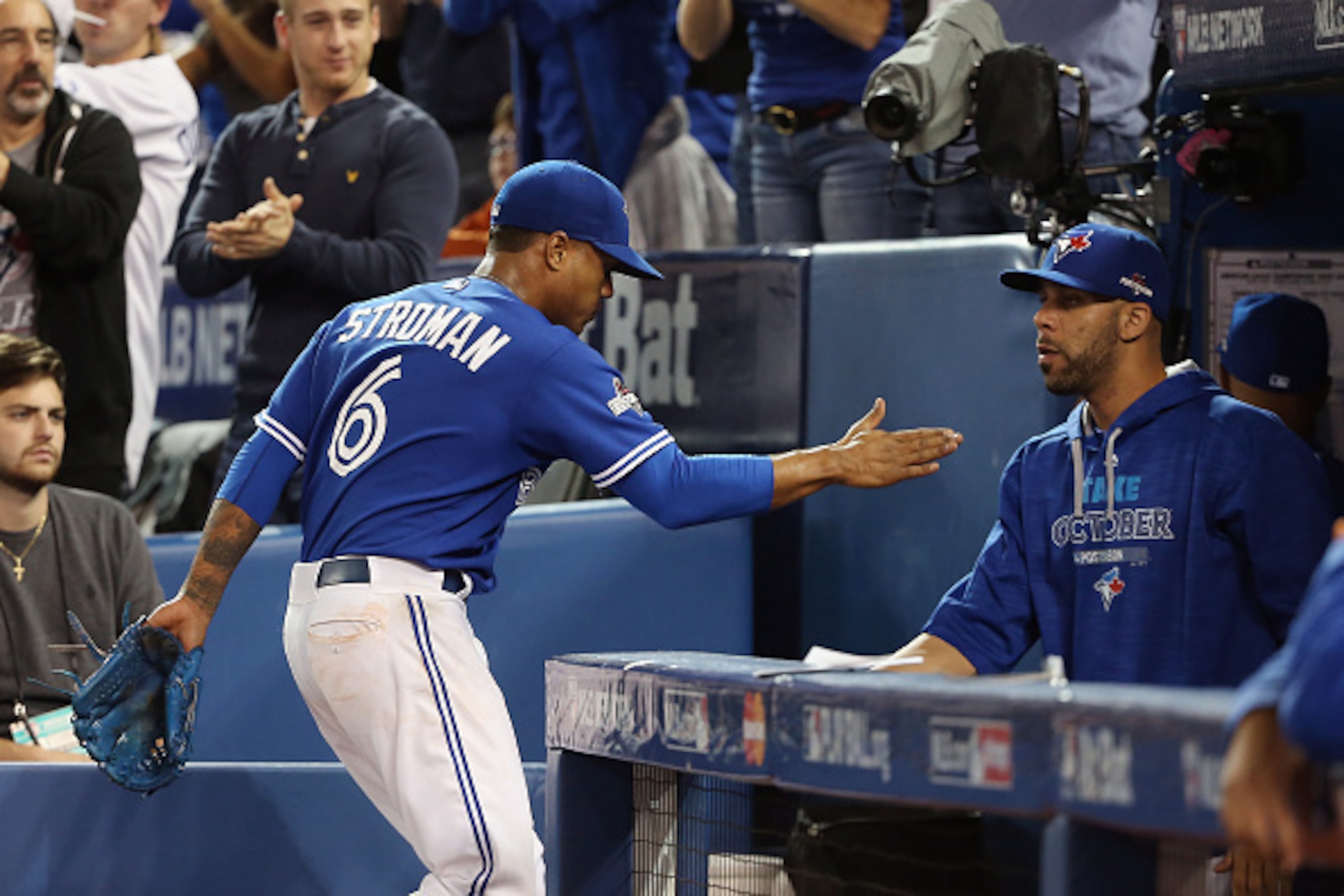 TORONTO, ON - OCTOBER 19:  Marcus Stroman #6 of the Toronto Blue Jays is congratulated by David Price #14 of the Toronto Blue Jays as he is relieved in the seventh inning against the Kansas City Royals during game three of the American League Championship