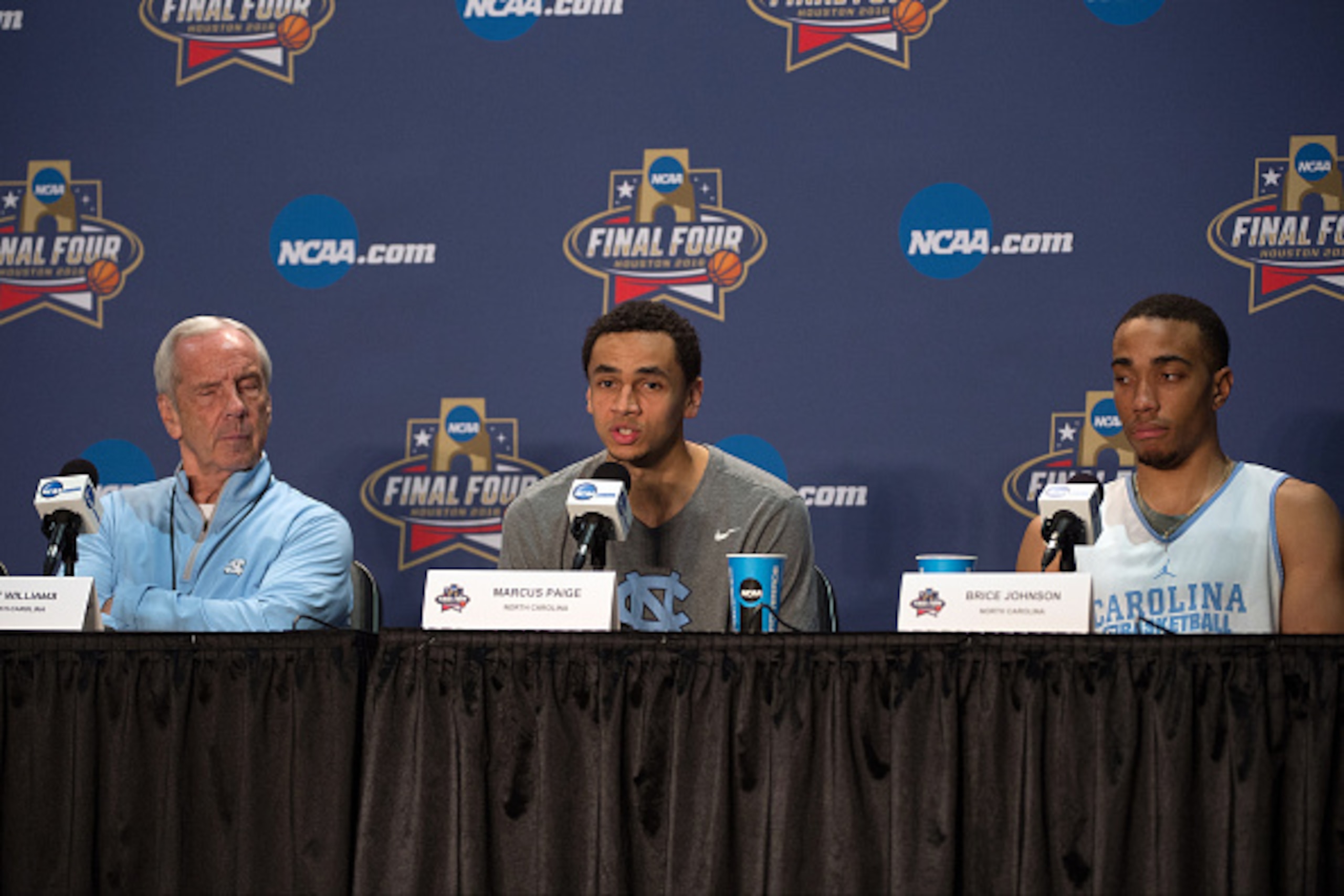 HOUSTON, TX - APRIL 01: (L-R) Head coach Roy Williams, Marcus Paige and Brice Johnson of the North Carolina Tar Heels speak with the media during a press conference prior to the 2016 NCAA Men's Final Four at NRG Stadium on April 1, 2016 in Houston, Texas.