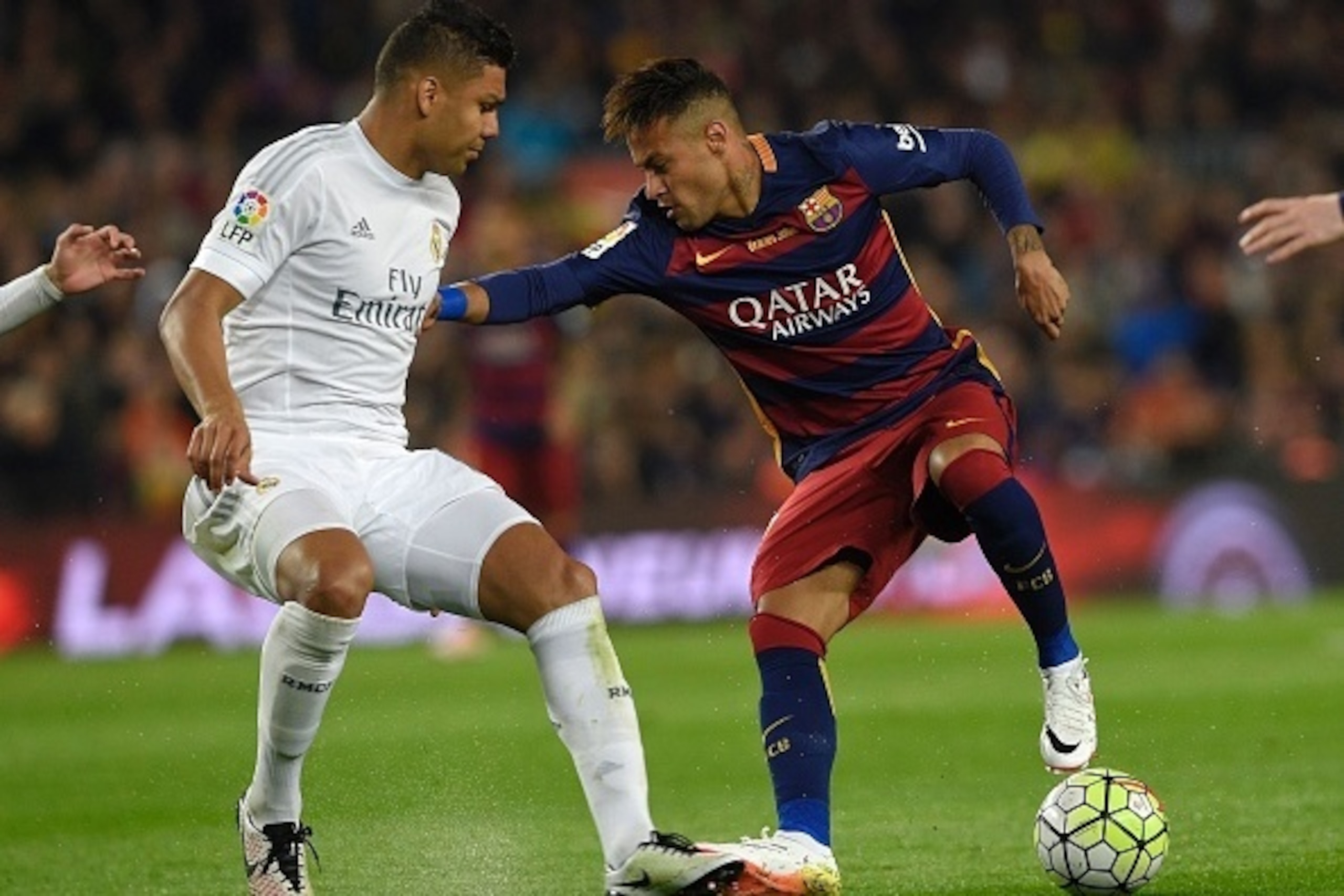 Barcelona's Brazilian forward Neymar (R) vies with Real Madrid's Brazilian midfielder Casemiro (L) during the Spanish league 'Clasico' football match FC Barcelona vs Real Madrid CF at the Camp Nou stadium in Barcelona on April 2, 2016. / AFP / LLUIS GENE Barcelona's Brazilian forward Neymar (R) vies with Real Madrid's Brazilian midfielder Casemiro (L) during the Spanish league 'Clasico' football match FC Barcelona vs Real Madrid CF at the Camp Nou stadium in Barcelona on April 2, 2016. / AFP / LLUIS GENE