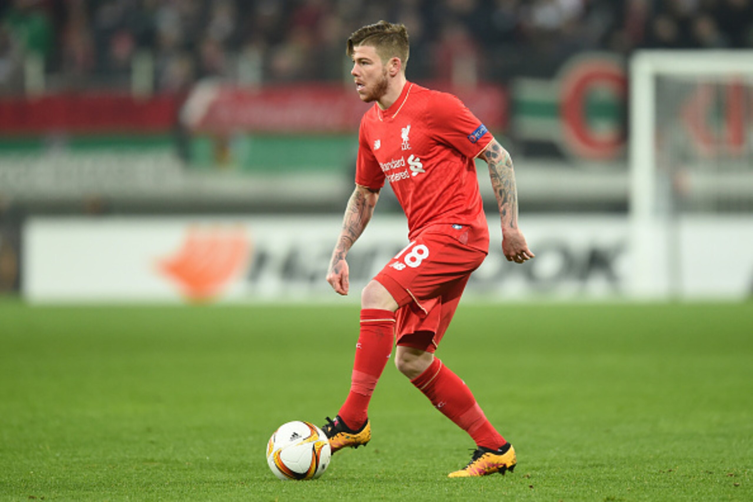 Liverpool's Spain defender Alberto Moreno plays the ball during the UEFA Europa League Round of 32 football match between FC Augsburg and Liverpool FC in the stadium in Augsburg, southern Germany on February 18, 2016. 
 / AFP / Christof STACHE        (Pho
