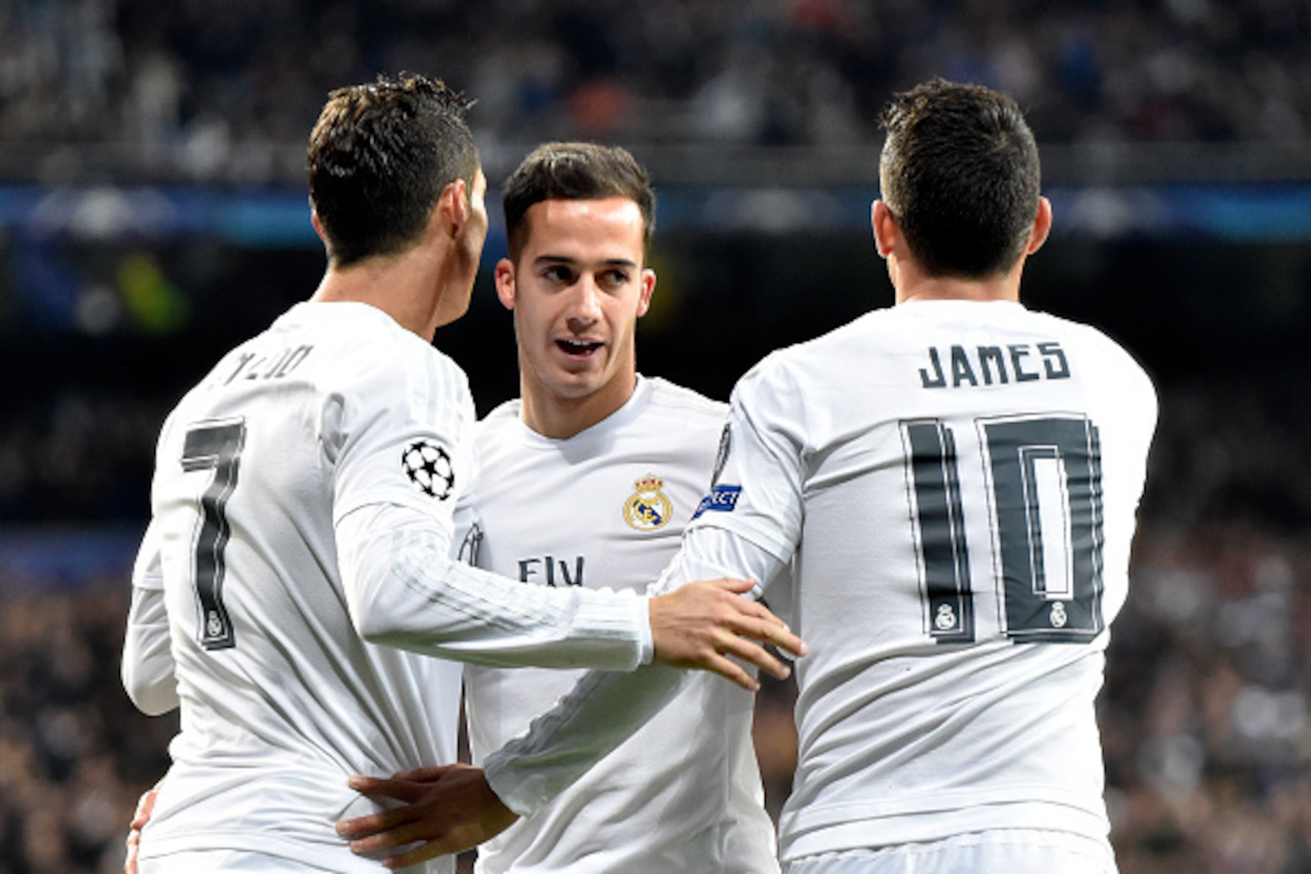 Real Madrid's Portuguese forward Cristiano Ronaldo (L), Real Madrid's midfielder Lucas Vazquez (C) and Colombian midfielder James Rodriguez celebrate a goal during the UEFA Champions League round of 16, second leg football match Real Madrid FC vs AS Roma 