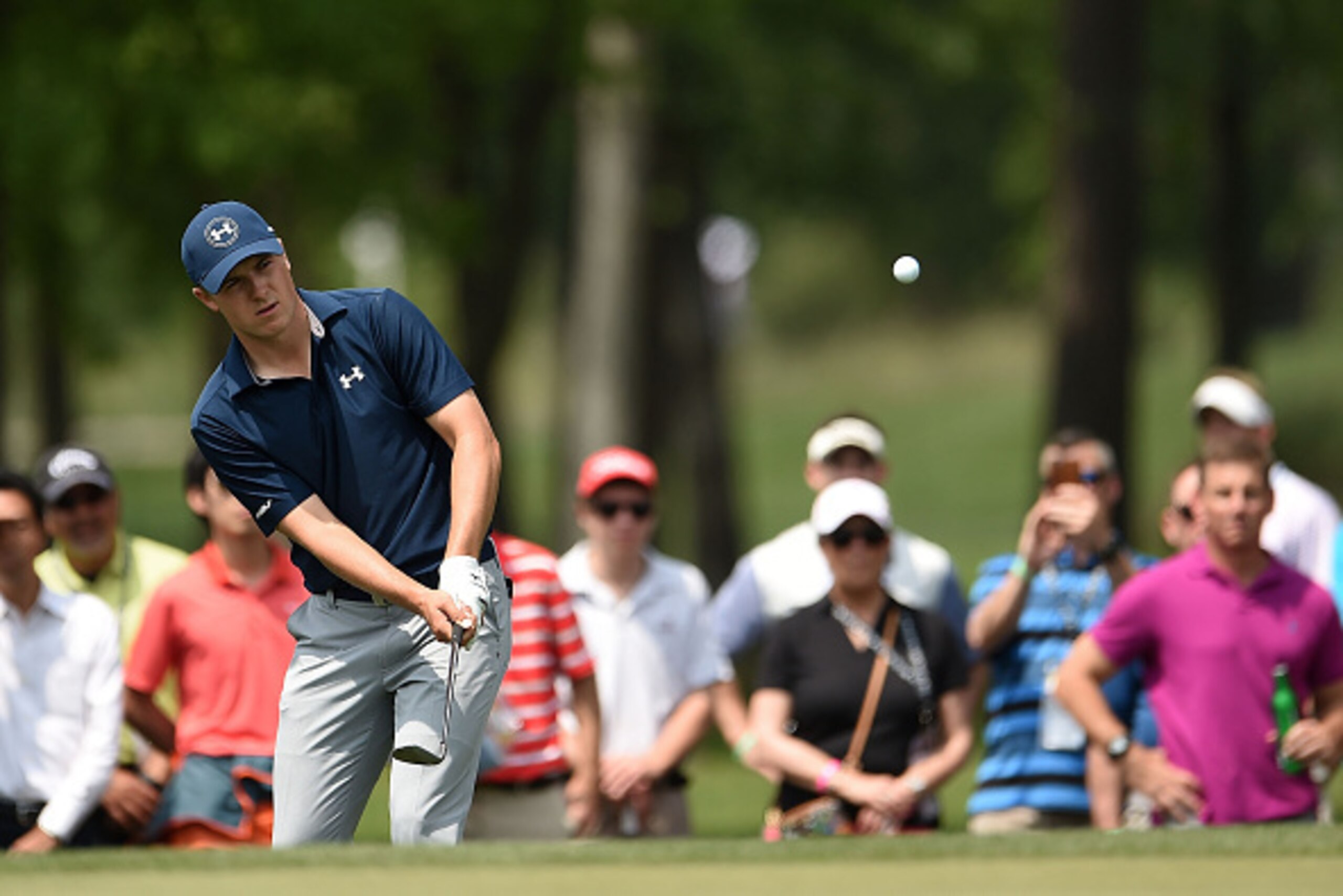 HUMBLE, TX - MARCH 31:   Jordan Spieth of the United States chips in for birdie on the second hole during the first round of the Shell Houston Open at the Golf Club of Houston on March 31, 2016 in Humble, Texas.  (Photo by Stacy Revere/Getty Images)