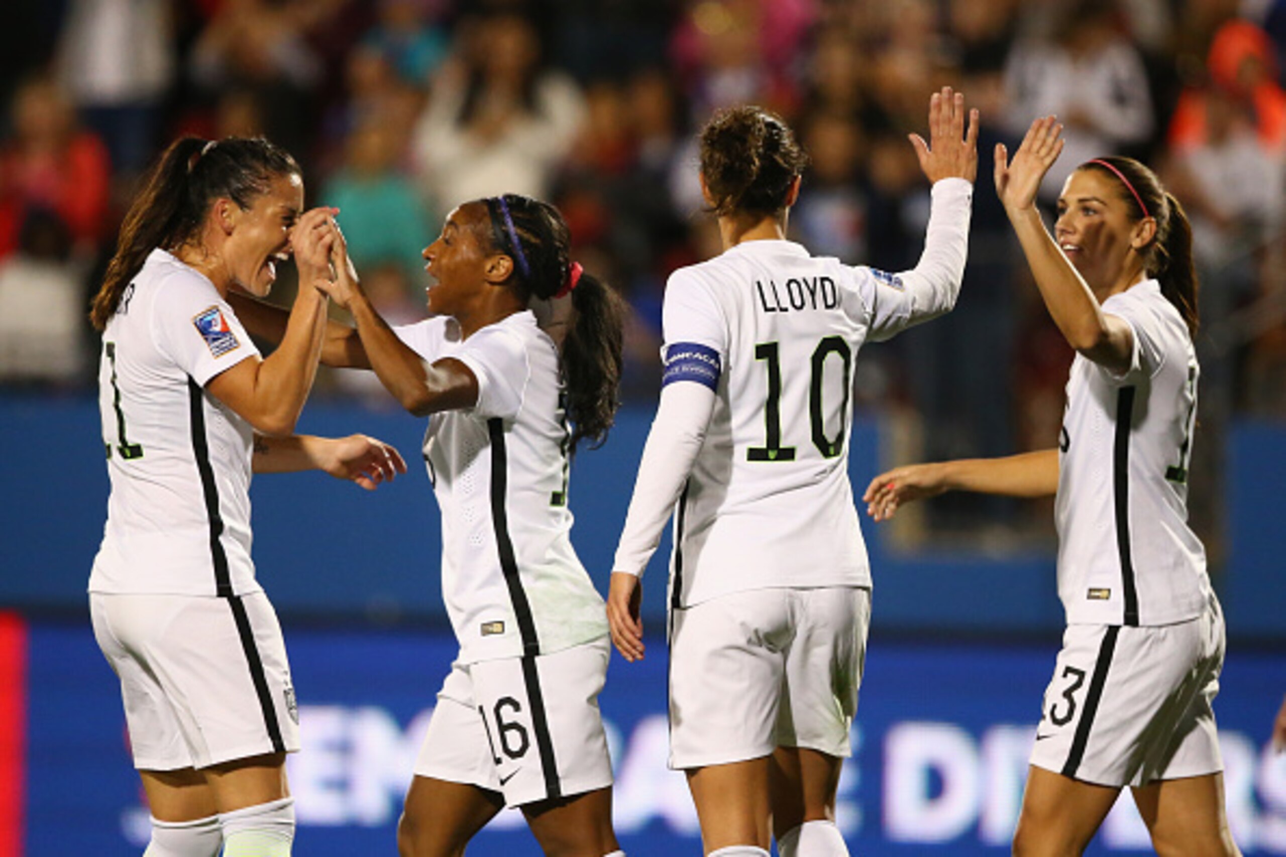 FRISCO, TX - FEBRUARY 10:  Crystal Dunn #16 of USA celebrates her goal with Ali Krieger #11, Carli Lloyd #10 and Alex Morgan #13 against Costa Rica during 2016 CONCACAF Women's Olympic Qualifying at Toyota Stadium on February 10, 2016 in Frisco, Texas.  (