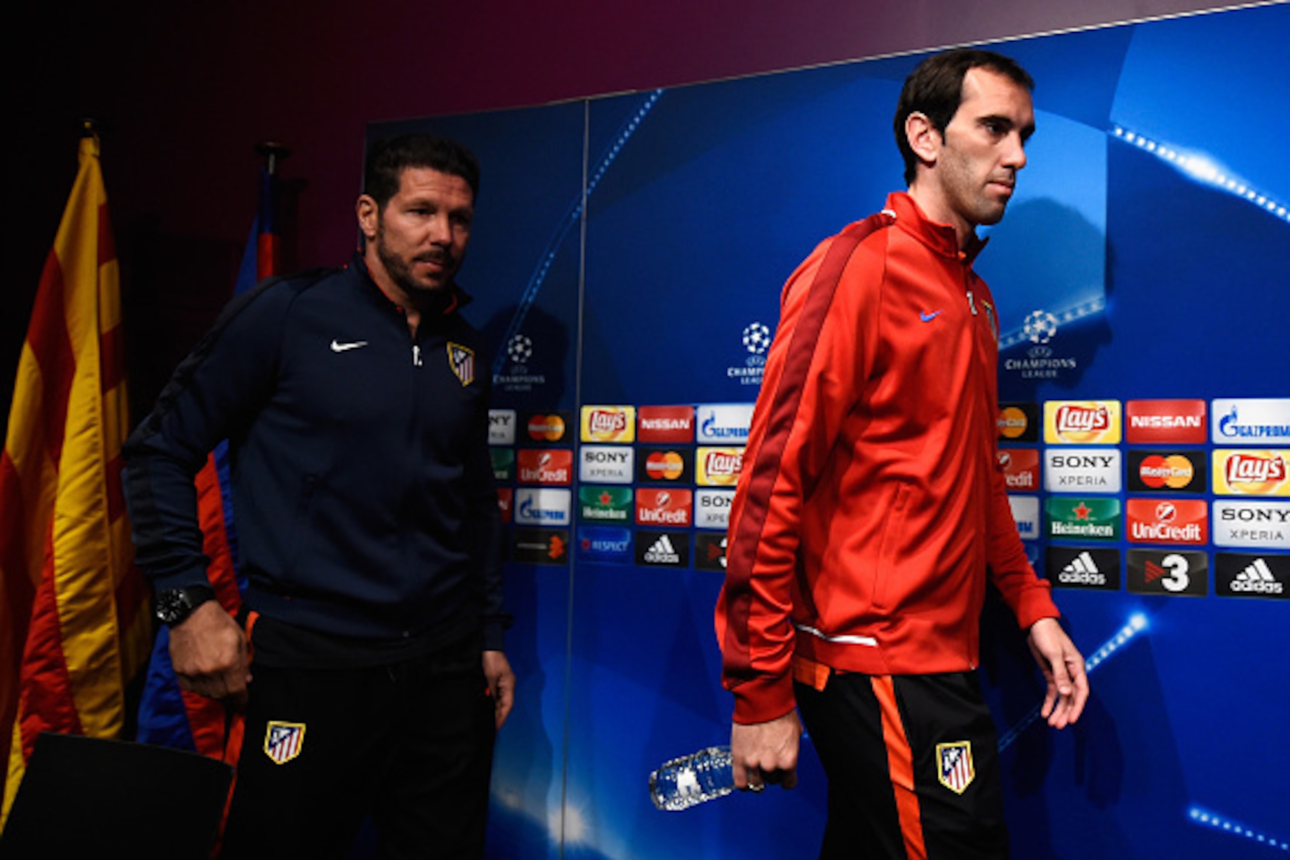 BARCELONA, SPAIN - APRIL 04:  Diego Simeone head coach of Atletico Madrid (L) and Diego Godin arrive at an Atletico Madrid press conference ahead of their UEFA Champions League quarter final first leg match against Barcelona at Camp Nou on April 4, 2016 i