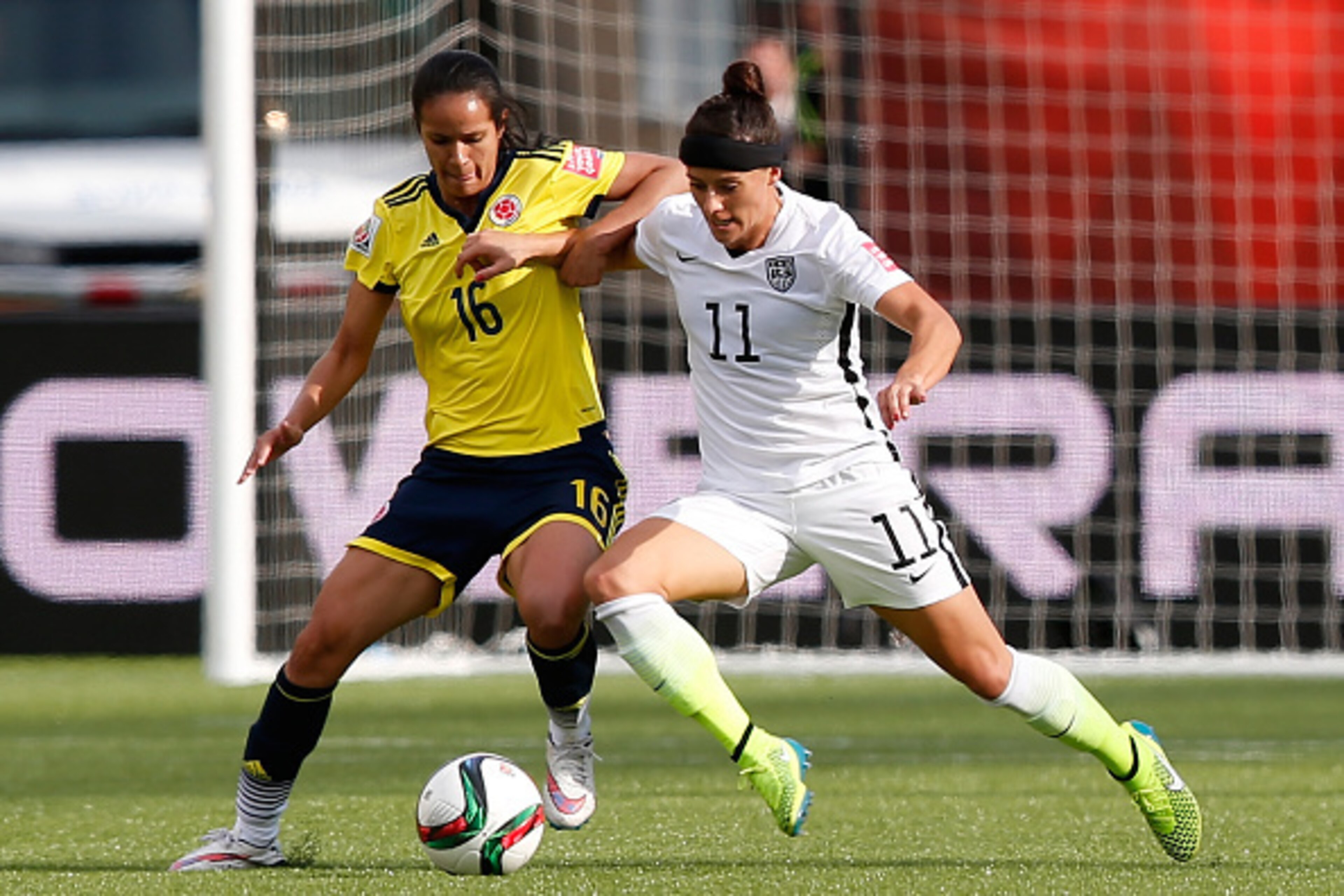 EDMONTON, AB - JUNE 22:  Lady Andrade #16 of Colombia and Alex Krieger #11 of the United States go after the ball in the FIFA Women's World Cup 2015 Round of 16 match at Commonwealth Stadium on June 22, 2015 in Edmonton, Canada.  (Photo by Todd Korol/Gett