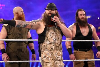 Erick Rowan and Braun Strowman stand guard behind Bray Wyatt.
